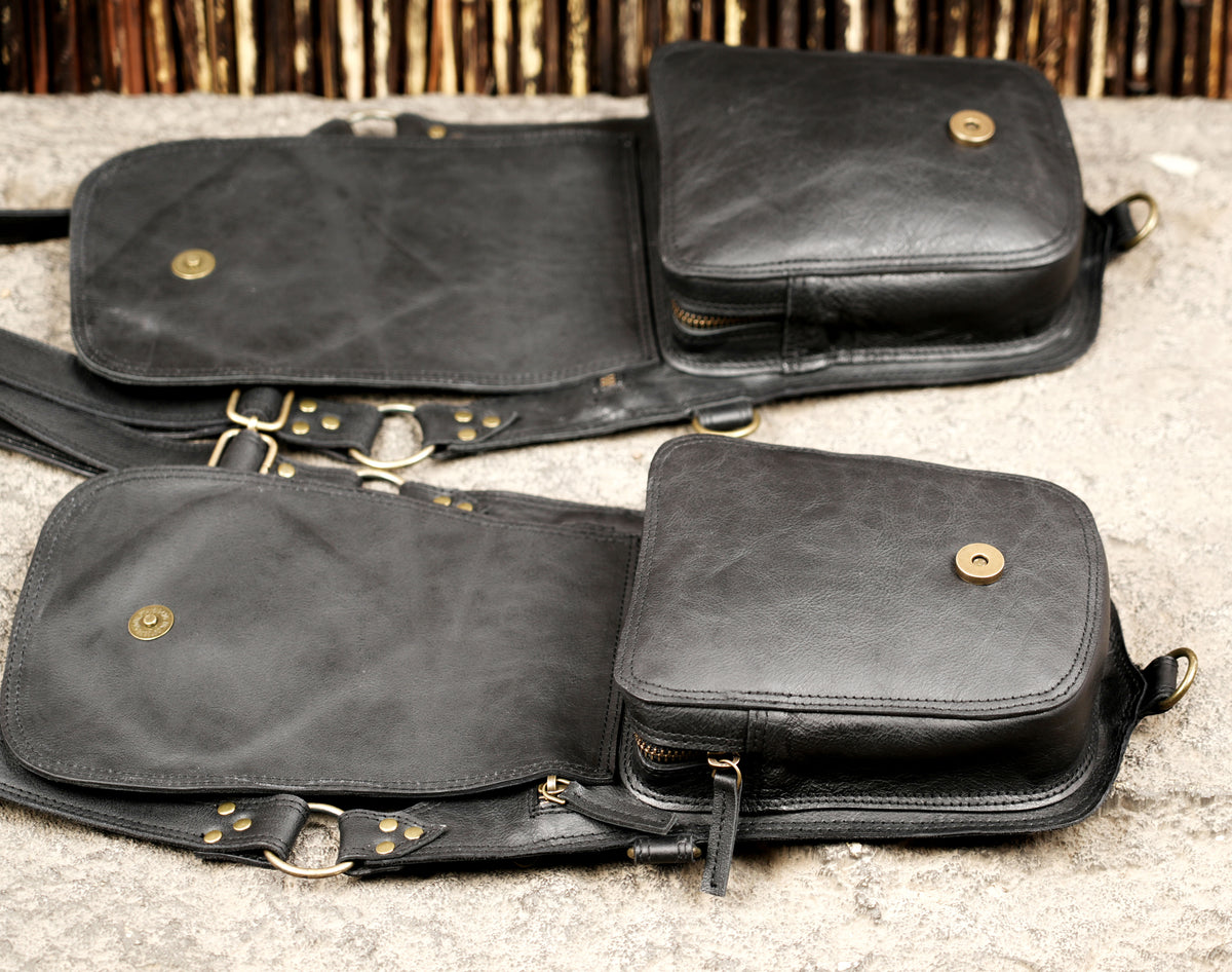 Unisex leather shoulder bag with double holster style pockets