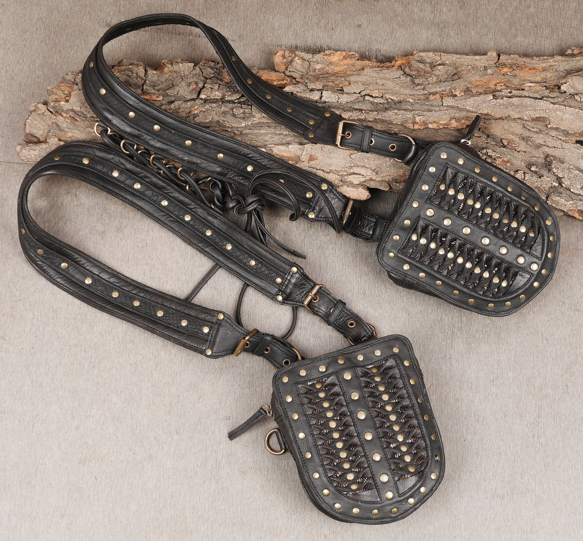 Decorative black leather leg harness with metal rings and adjustable buckle straps