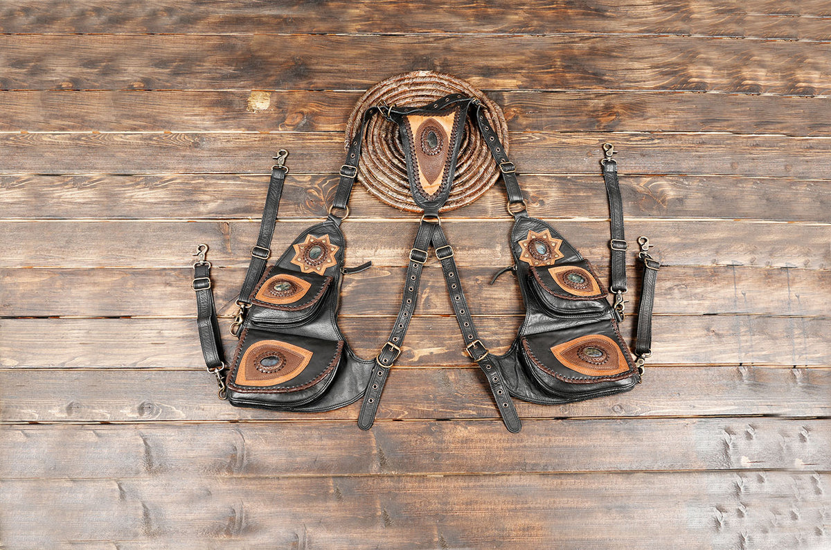Black leather harness bag set with brown gemstone pockets and adjustable straps
