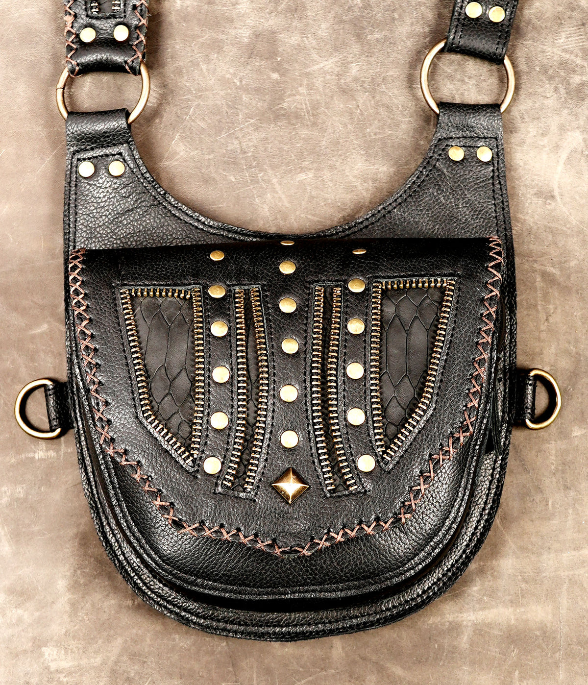 Handcrafted leather harness with two matching bags and decorative flap designs