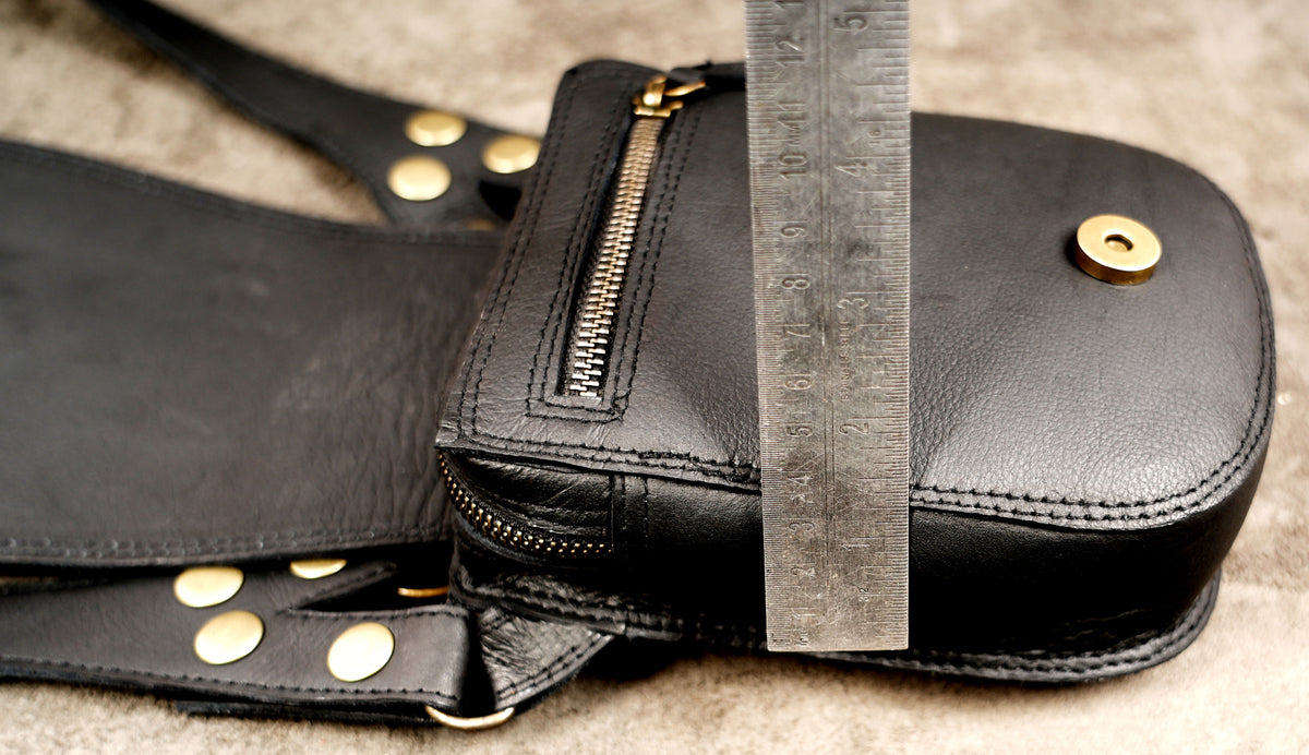 Gothic festival accessory with dual leather pouches and brass-tone studs
