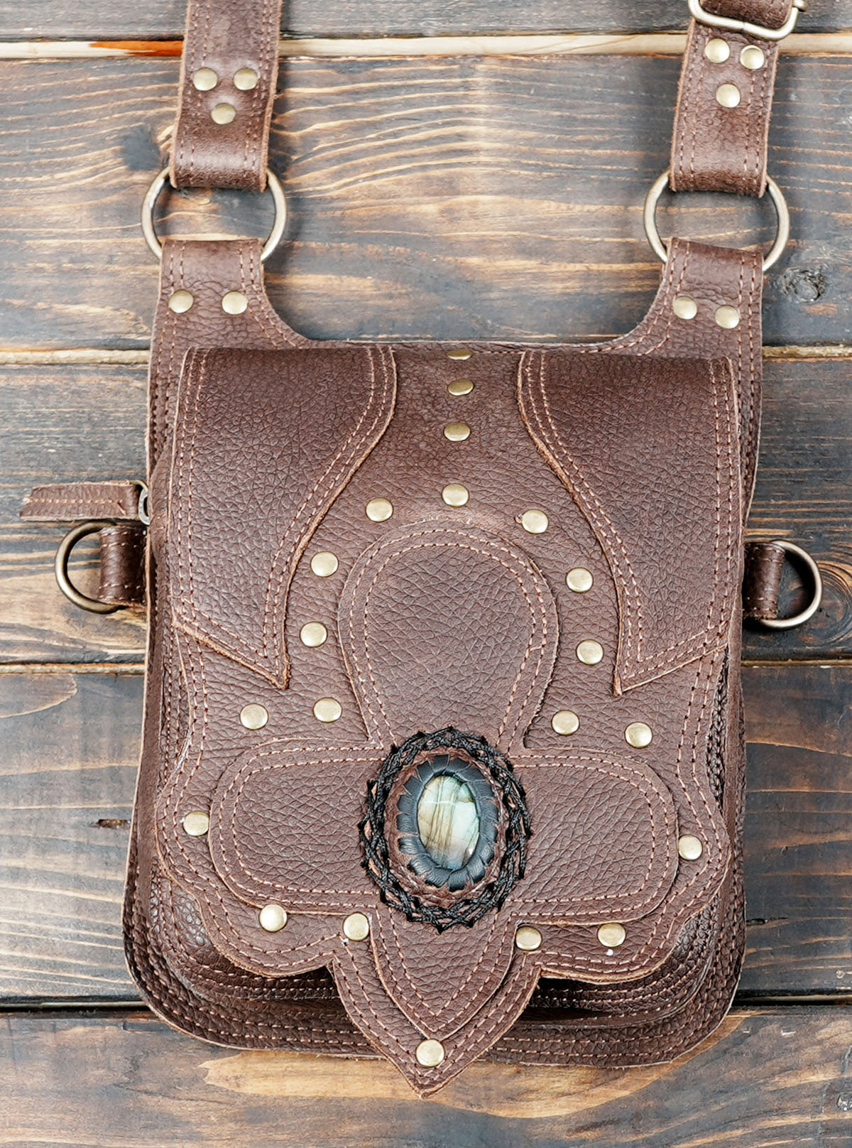 Unisex leather shoulder harness bag with gemstone pocket flaps