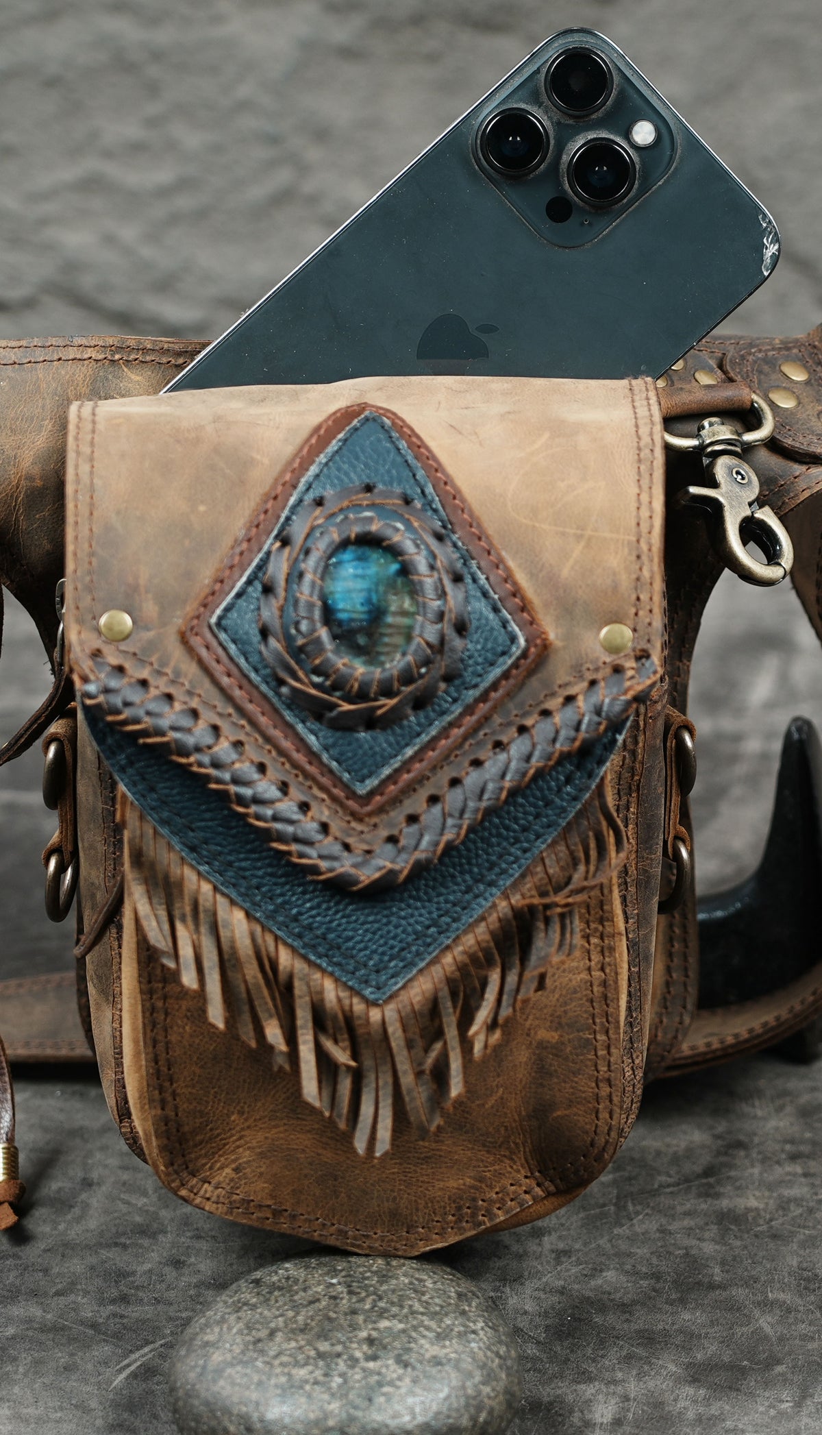 Brown leather waist bag with fringe detail and adjustable belt