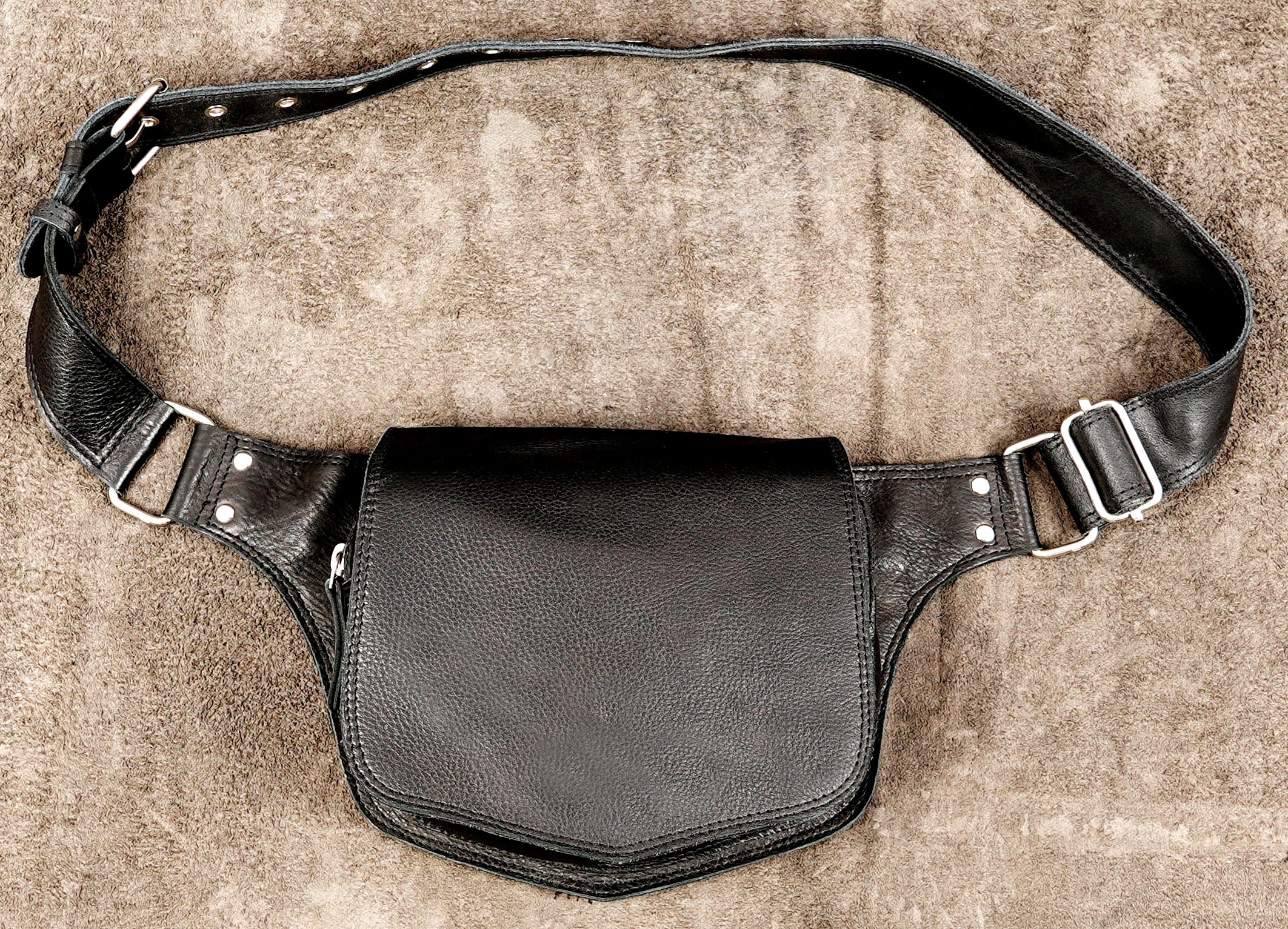 Handmade black leather belt bag with pointed flap design