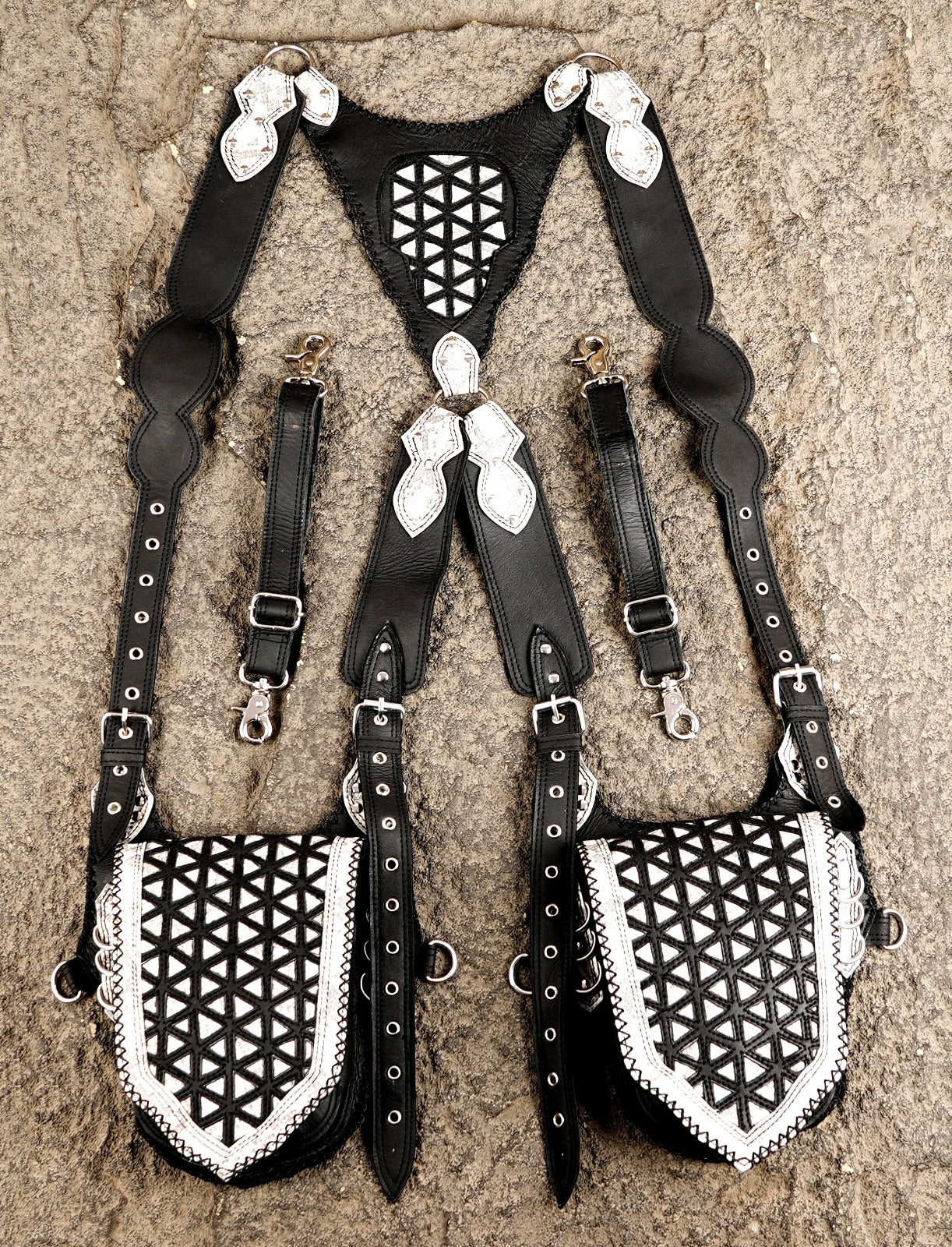 Handmade black leather harness bag with white mosaic pattern and double pouches