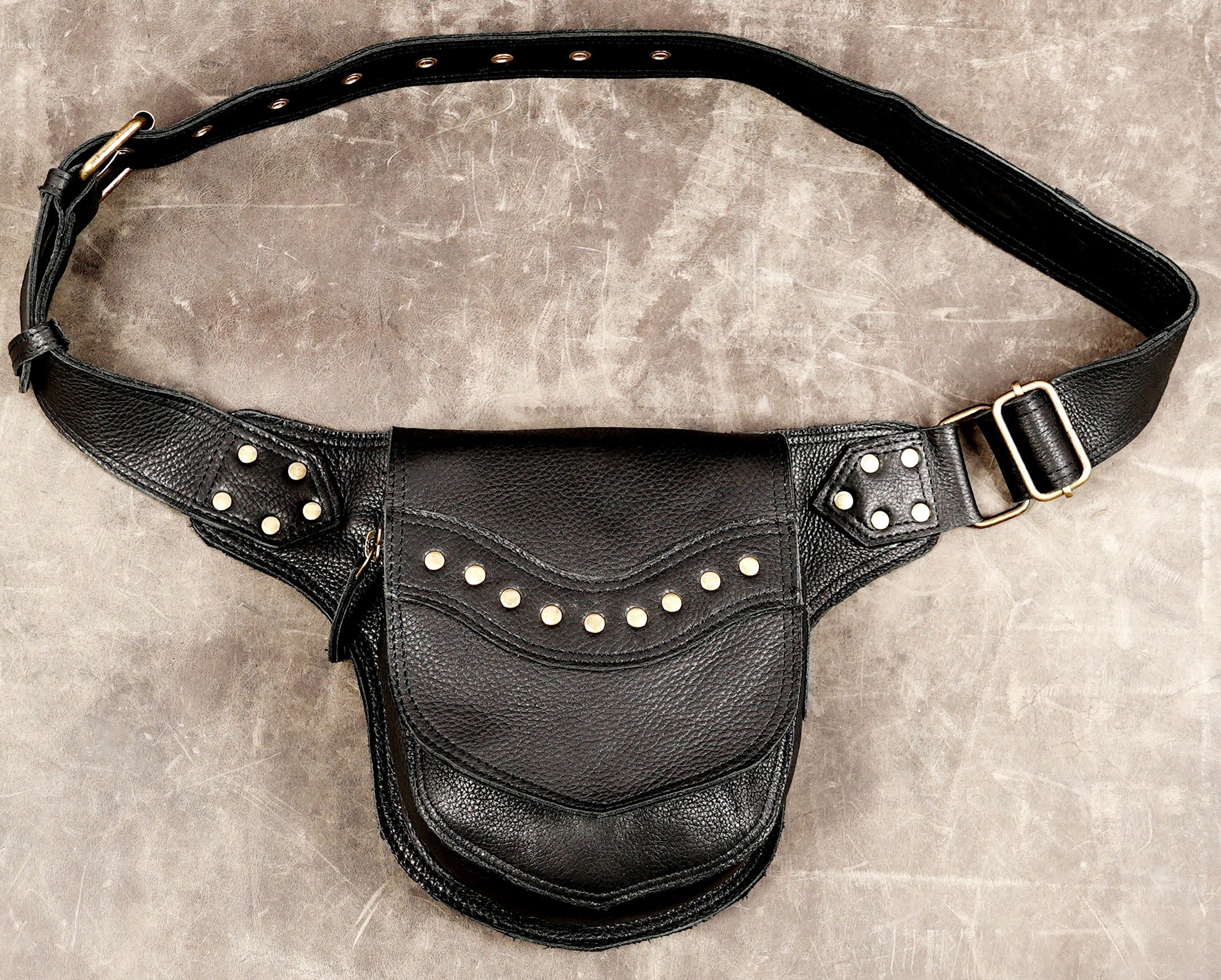 Handmade black leather hip bag with brass stud detail