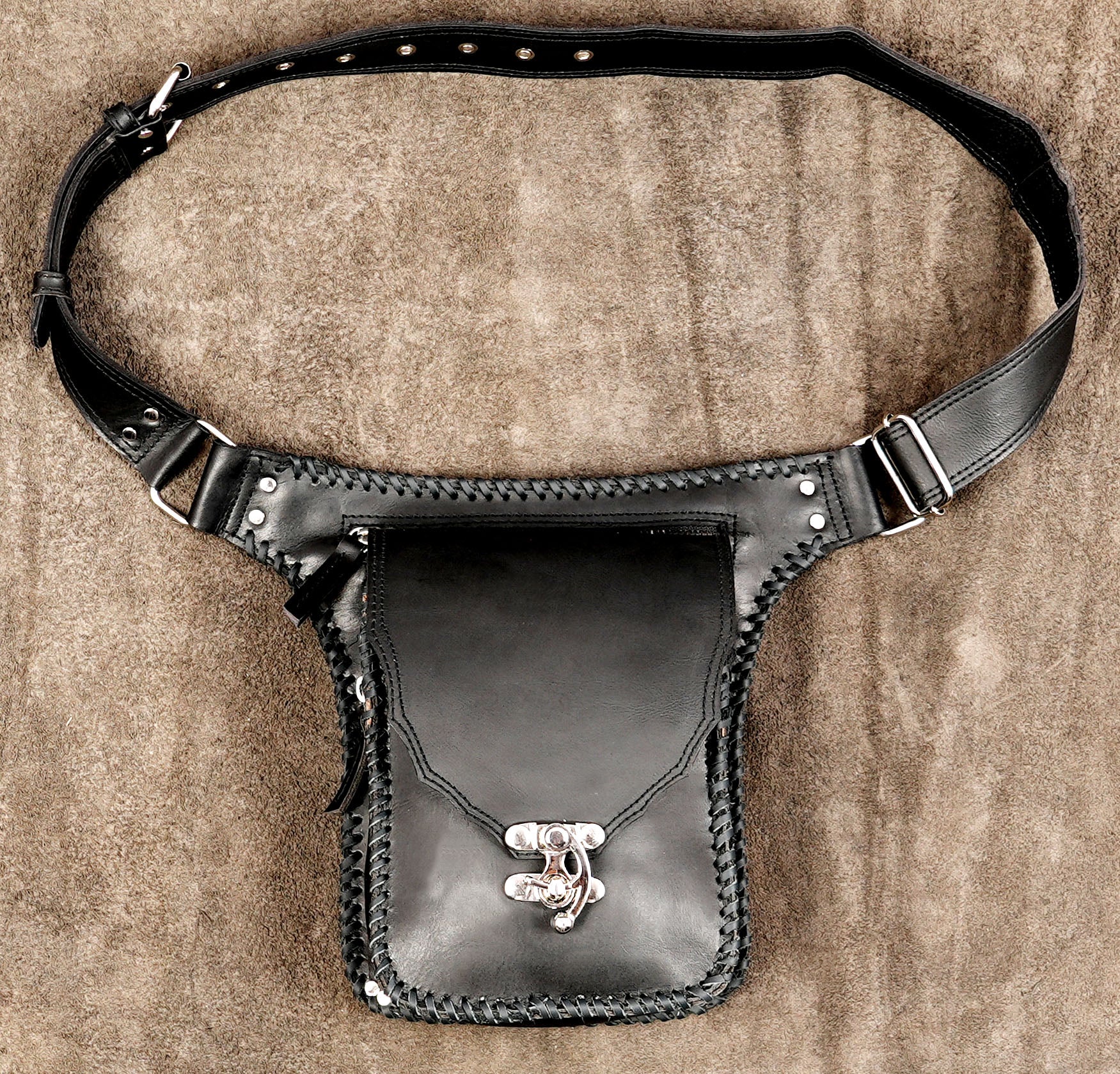 Handmade black leather hip bag with silver turn lock clasp