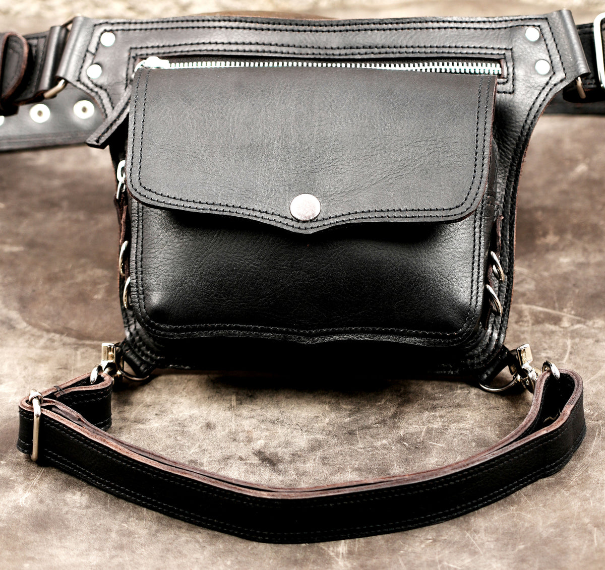 Handmade black leather utility bag for travel and festivals