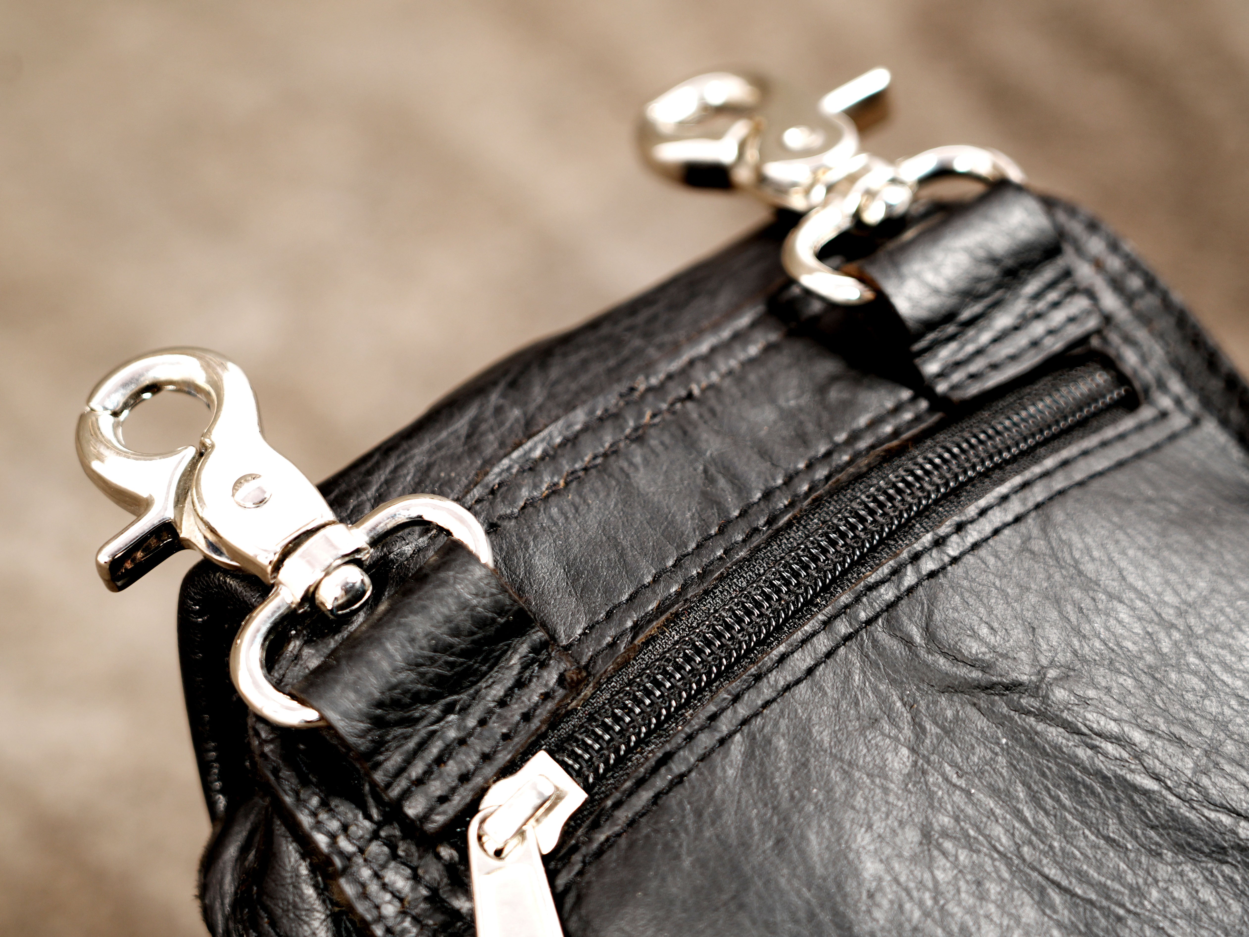 Handmade festival hip bag with brass studs and braided details