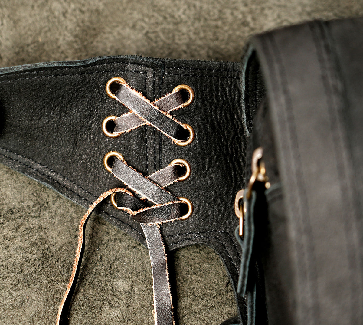 Handmade leather bag with medallion accent