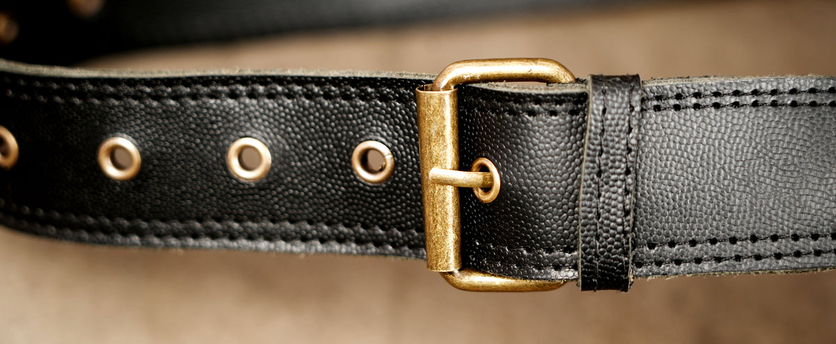 Handmade leather bag with zipper and studs