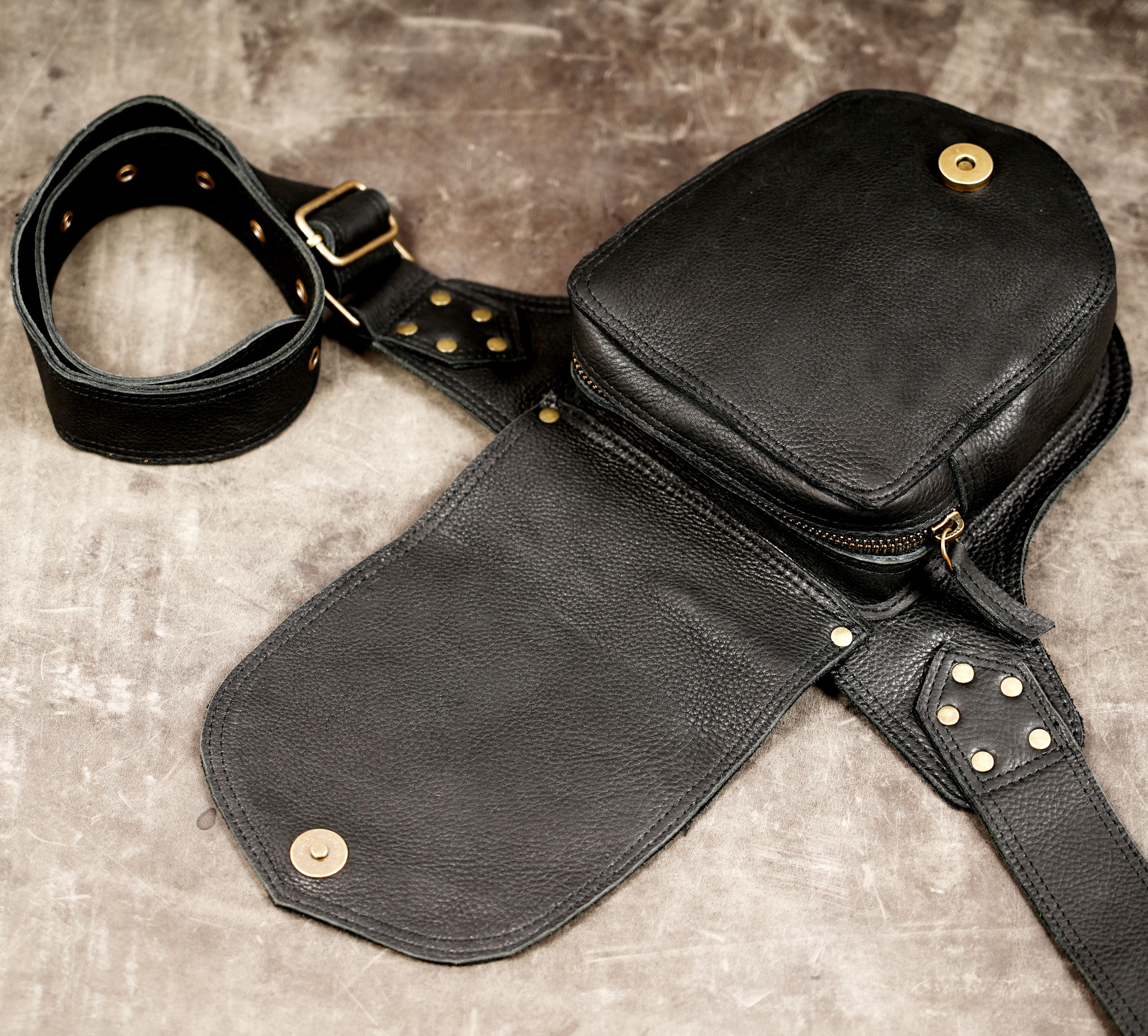Handmade leather festival waist bag with secure pocket design