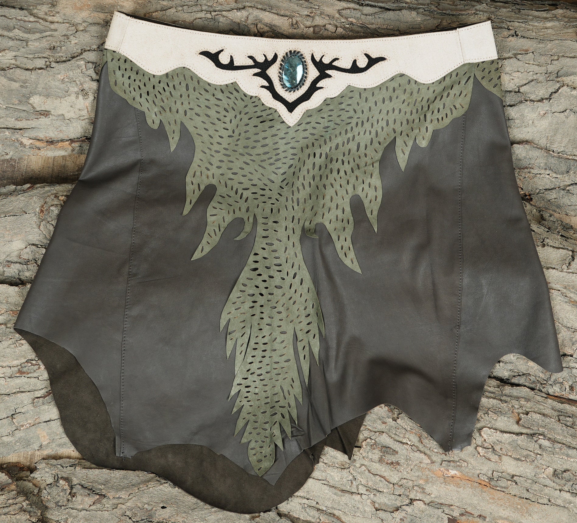 Handmade leather forest skirt with antler design and stone