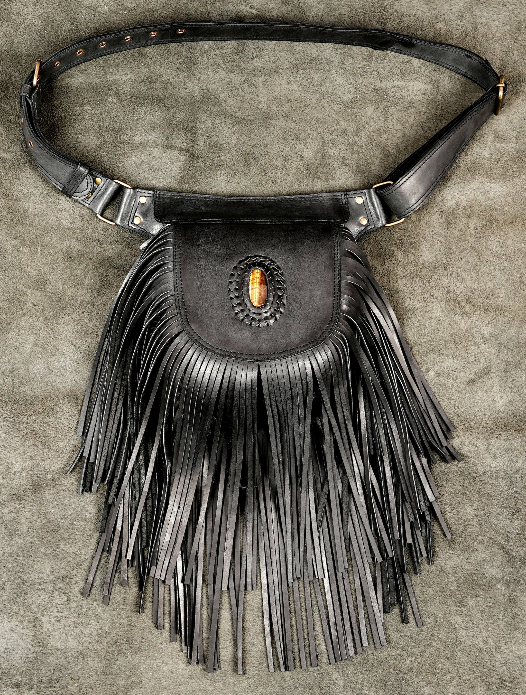 Handmade leather fringe hip bag with tiger eye stone centerpiece