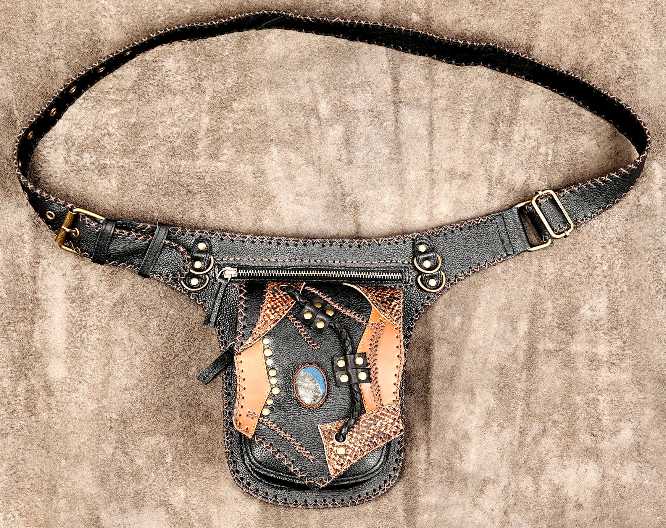 Handmade leather hip bag with natural stone and braided leather detail