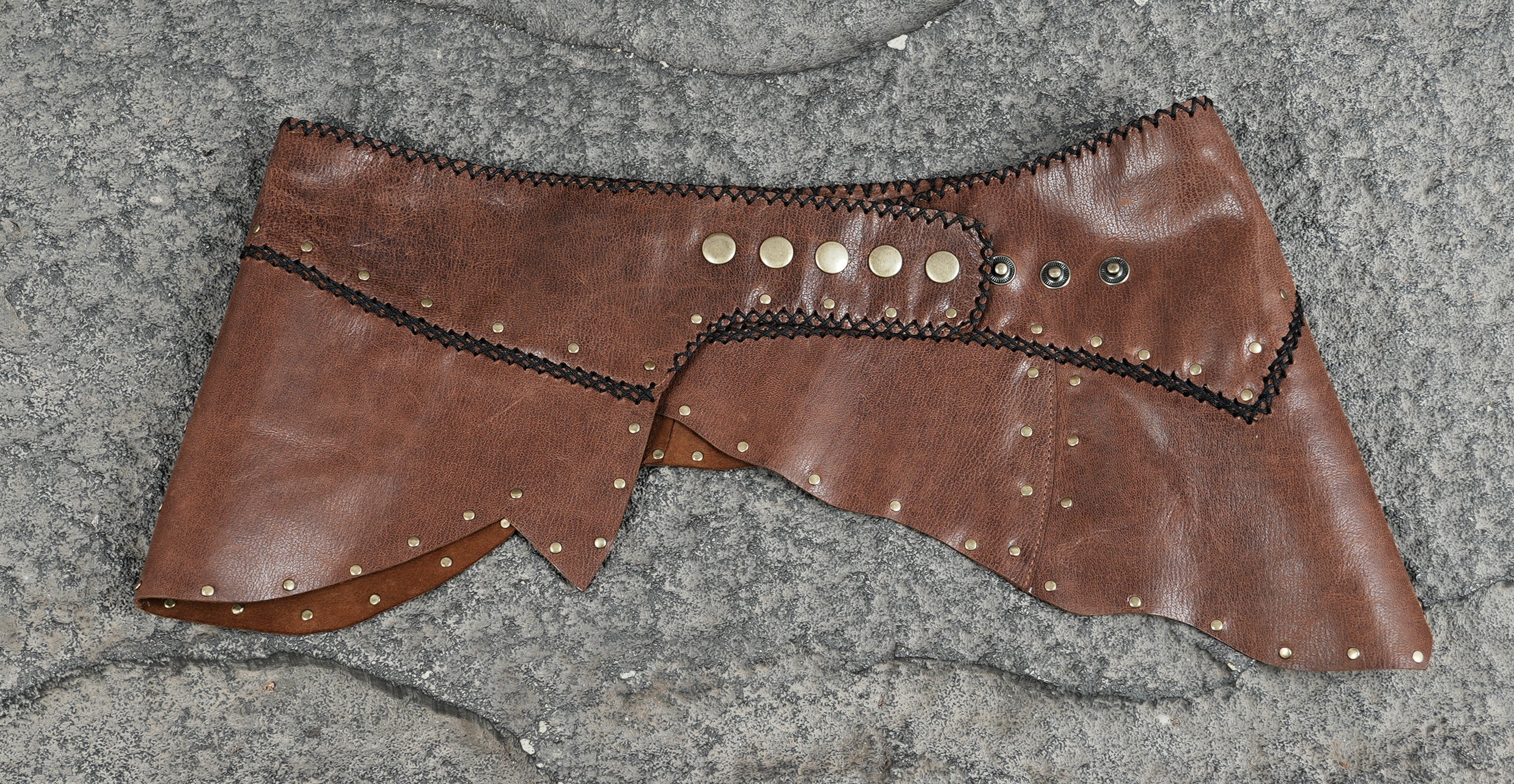 Handmade leather rock skirt with brass studs, full view