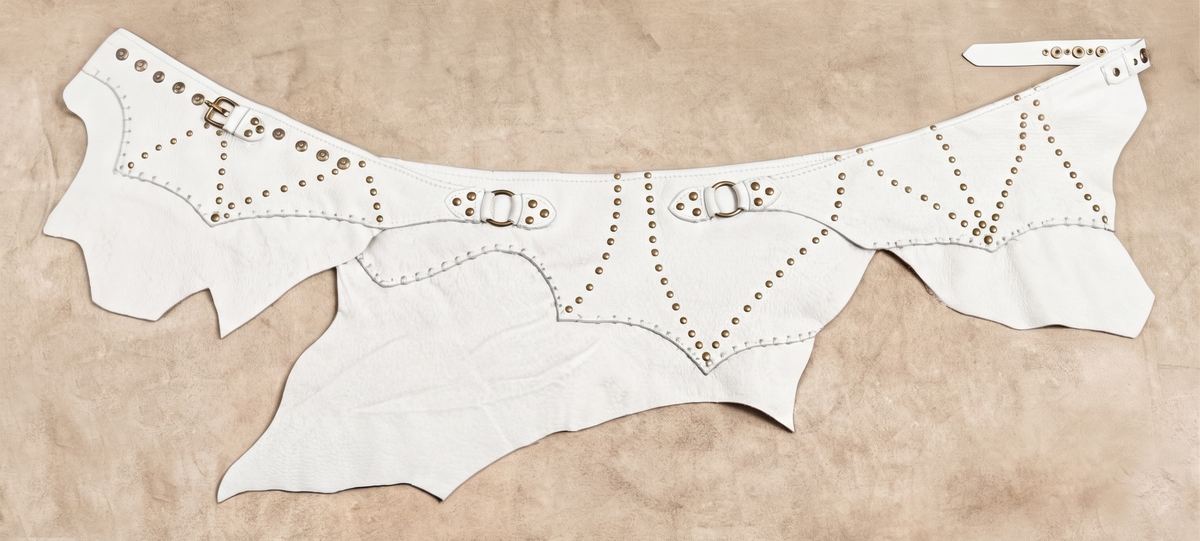 Handmade festival clothing with dark brown leather and metallic stud embellishments