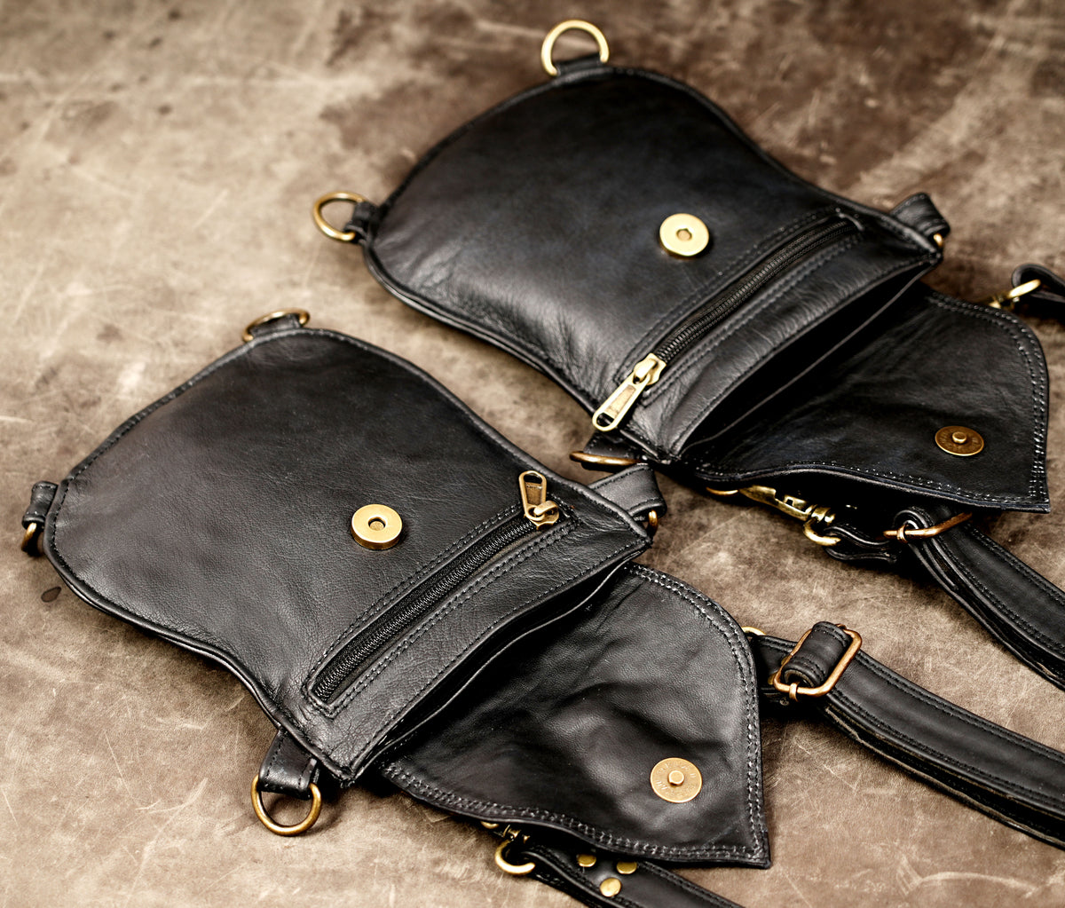Black leather chest harness with adjustable straps and utility bags
