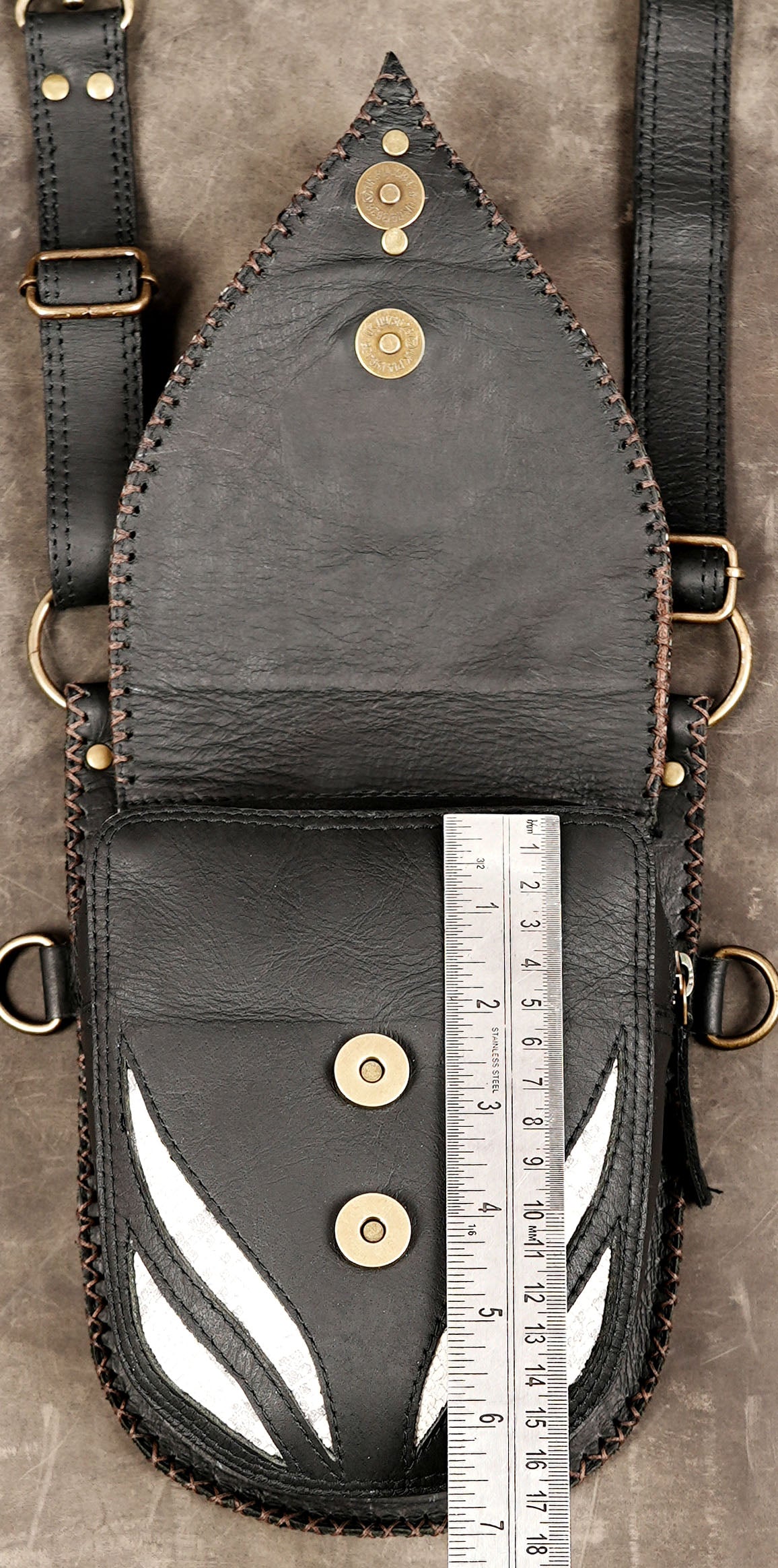 Steampunk utility body harness with matching holster bags and hardware.