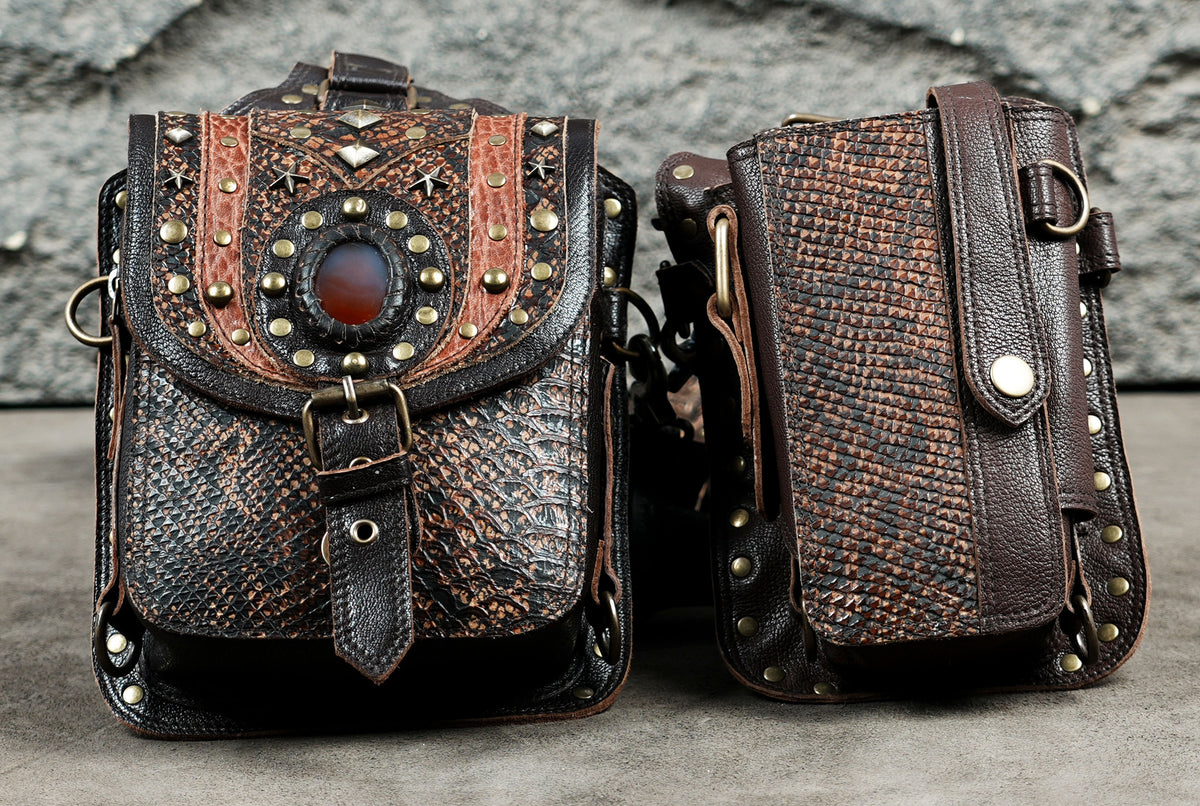 Steampunk leather body harness bag with studded details and matching utility pouches.
