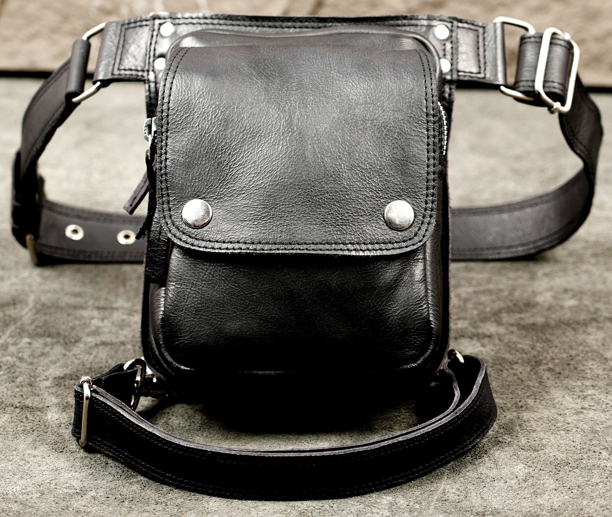Handmade leather festival bag with leg strap loop
