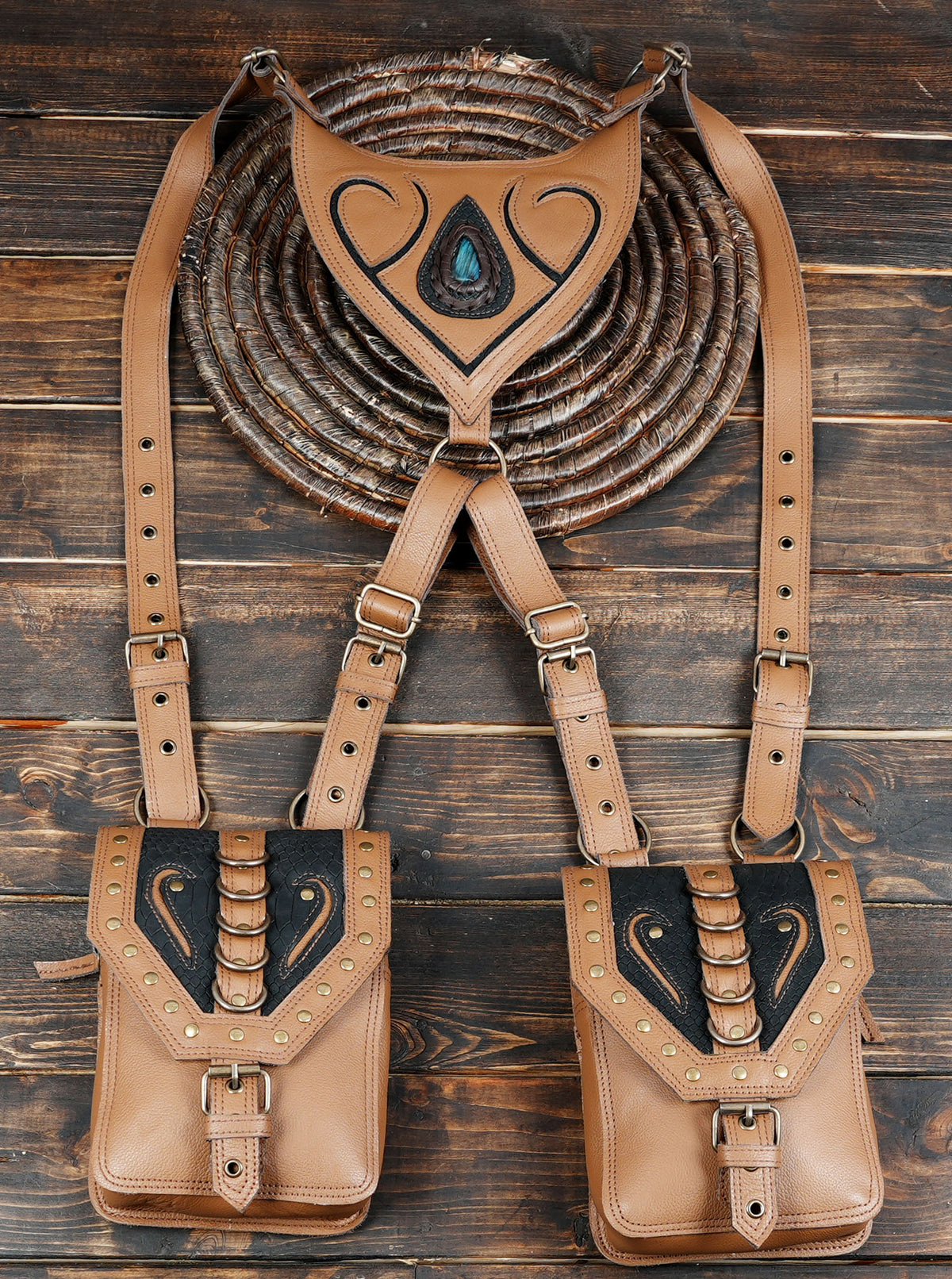 Artisan leather shoulder bag set with blue toned gemstone decoration