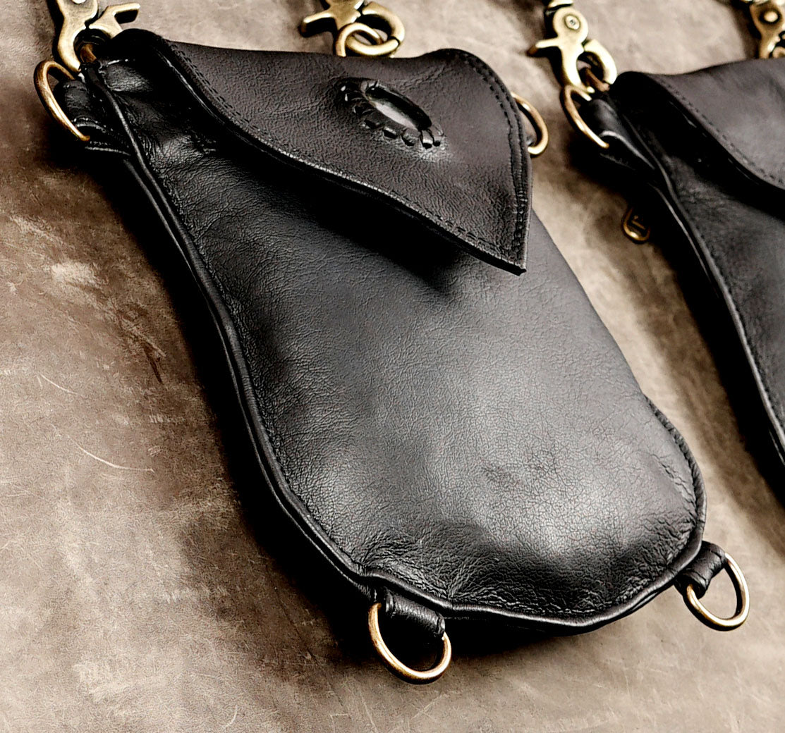 Black leather double shoulder harness bag with two utility pouches