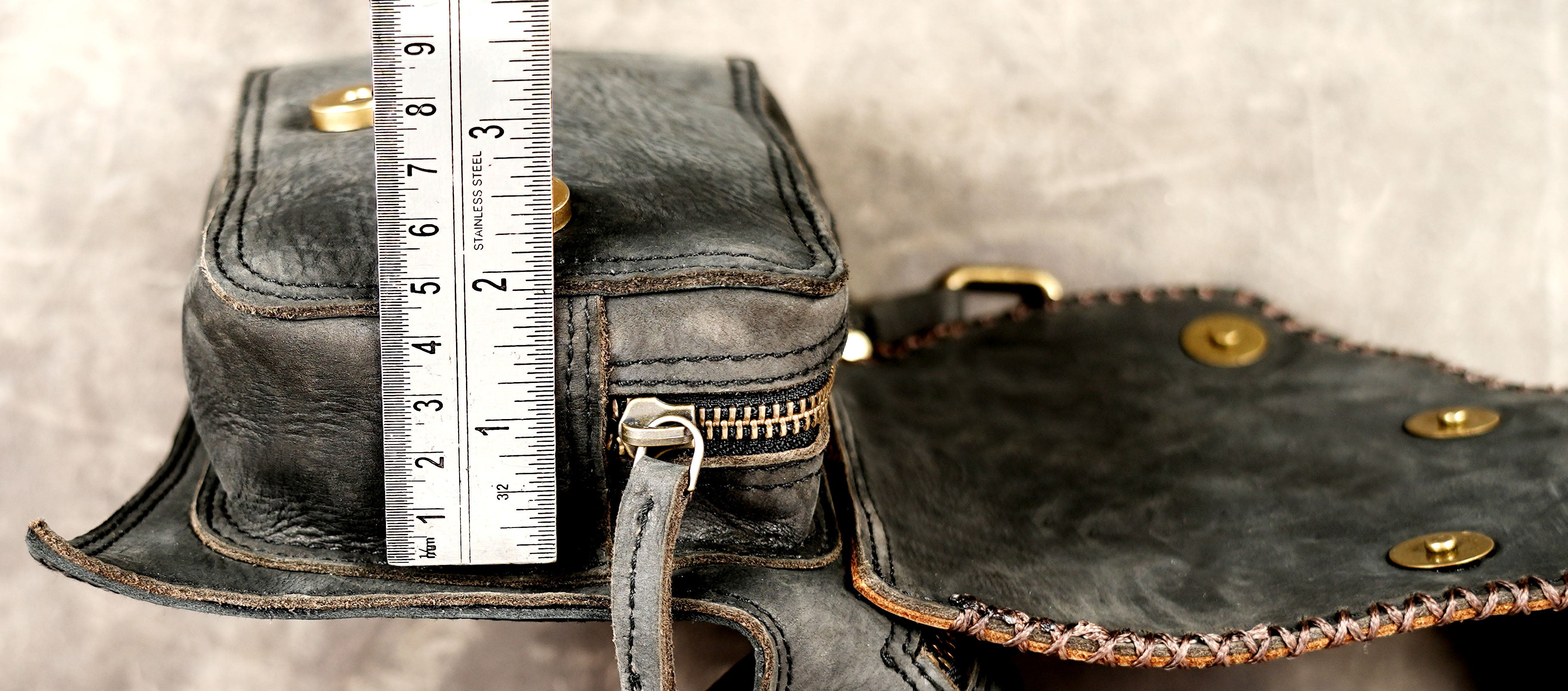 Hands-free leather waist pouch with secure zipper closure
