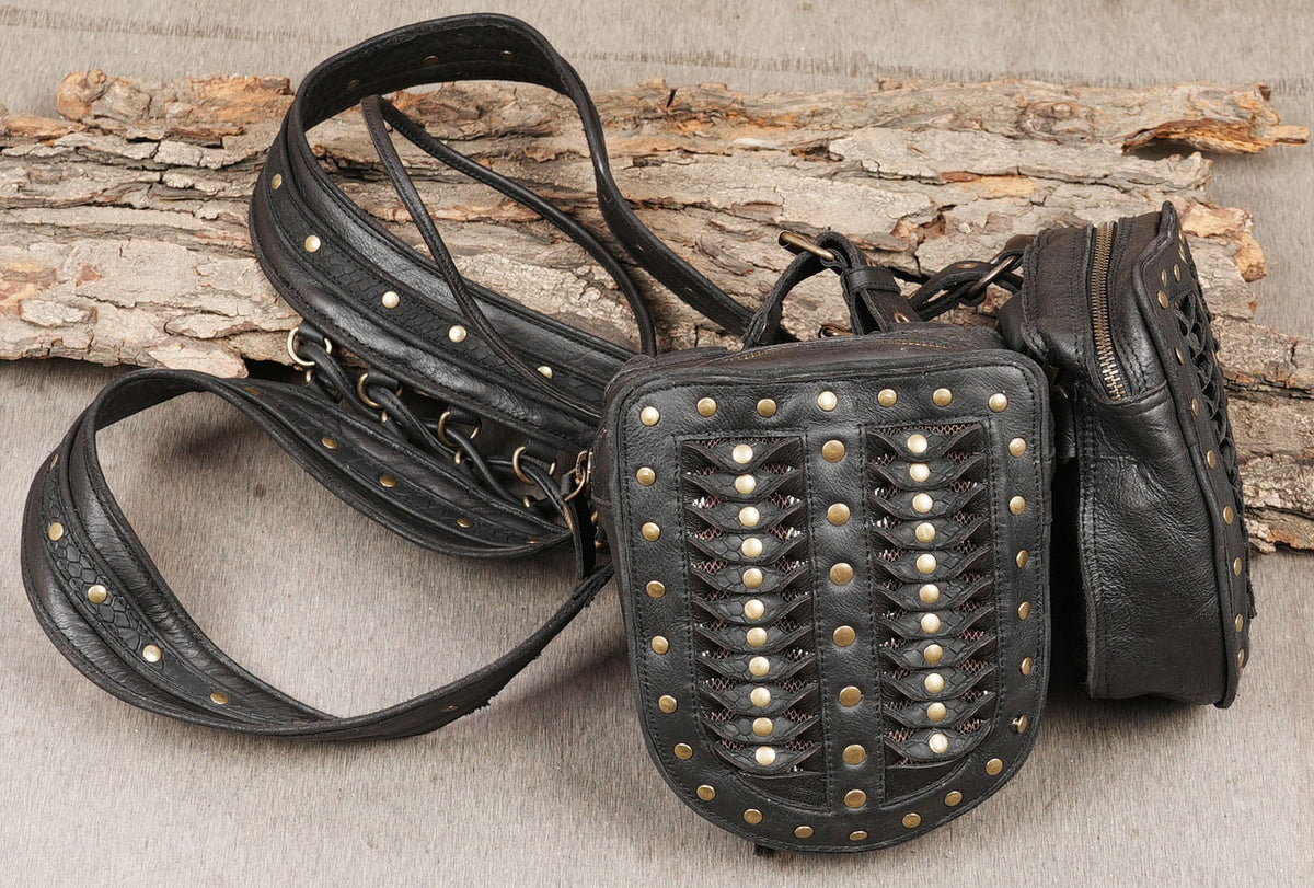Handcrafted black leather thigh straps with decorative studs and gothic styling