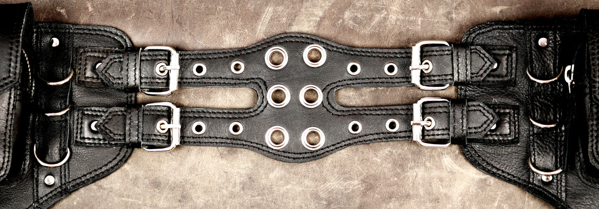 Industrial leather belt with silver hardware and buckles