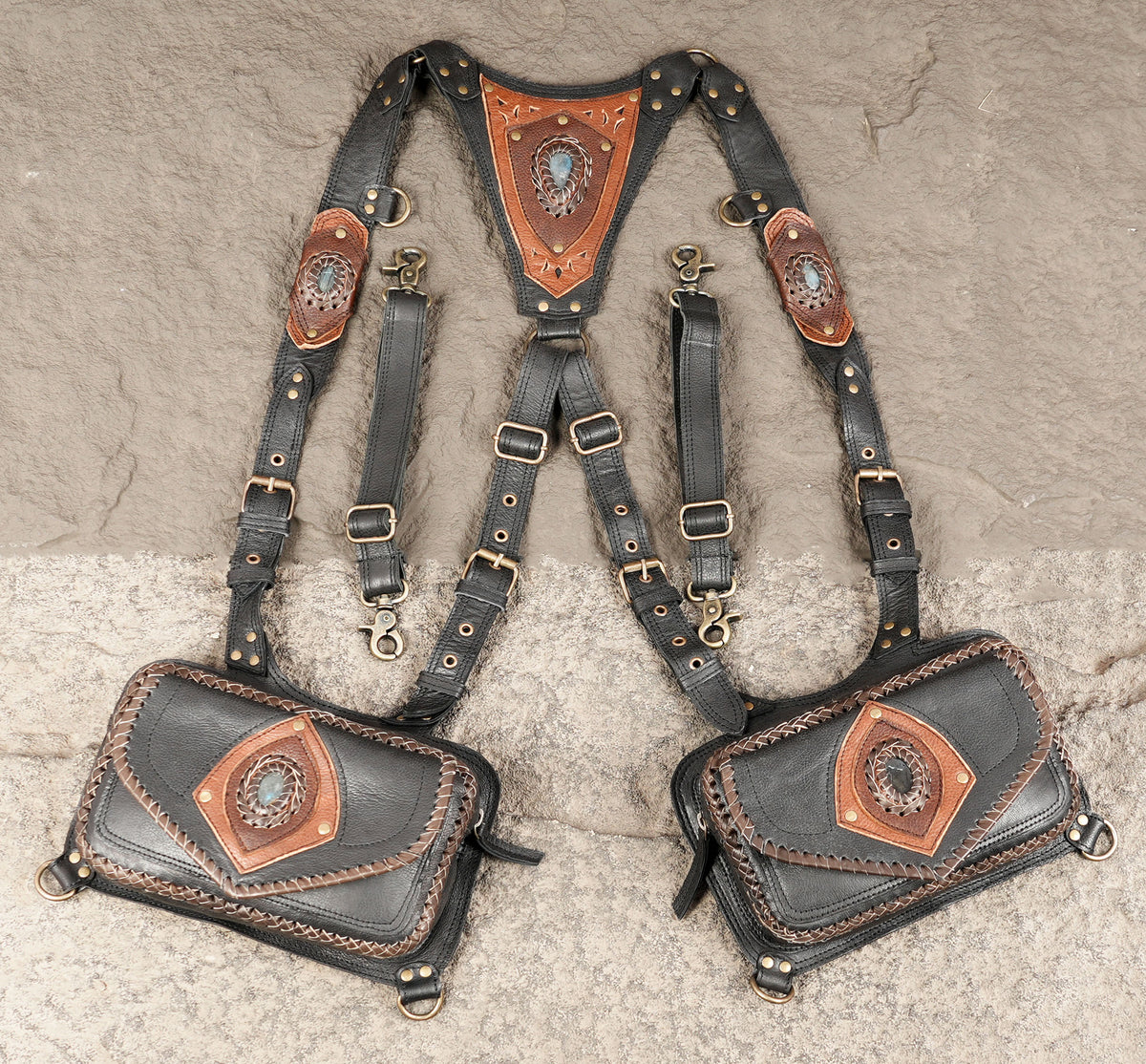 Black leather shoulder holster harness with matching dual hip pouches
