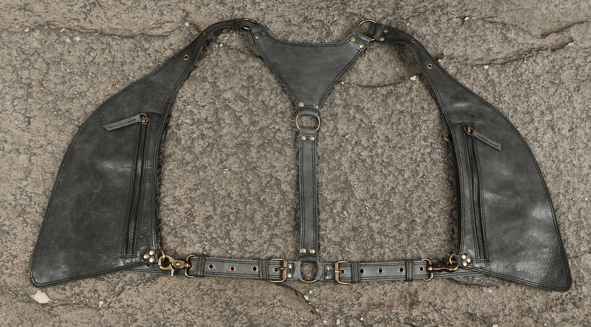 Black leather shoulder holster with multiple zippered pockets