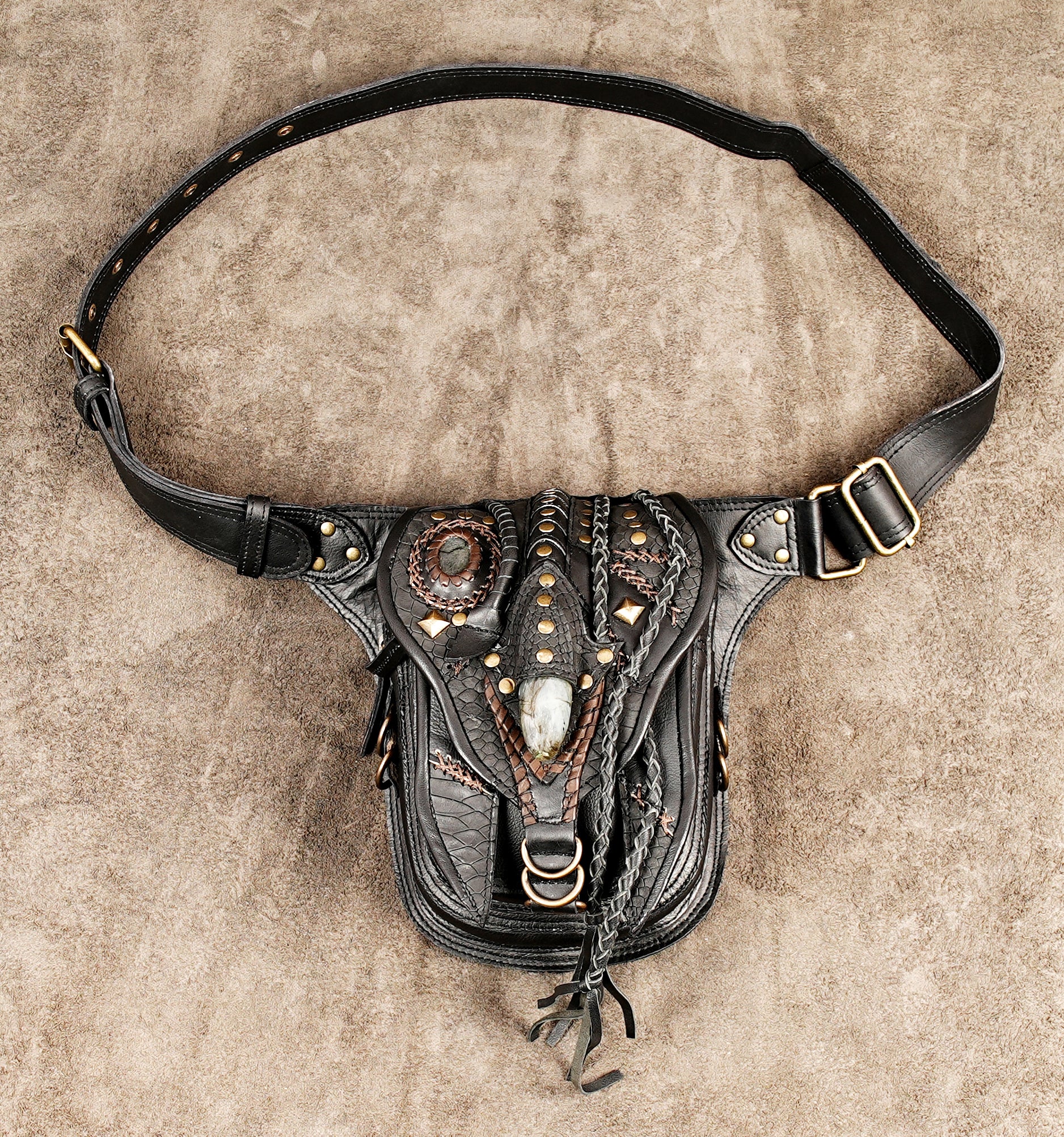 Tribal style leather utility belt bag with gemstone embellishment and brass metal rivets.