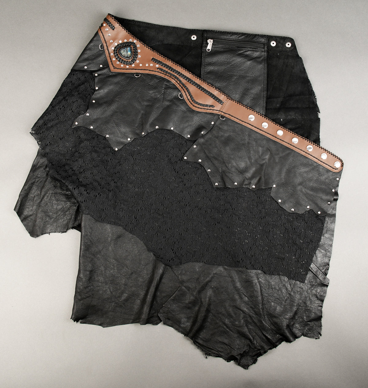 Layered black leather skirt designed for festivals and alternative outfits