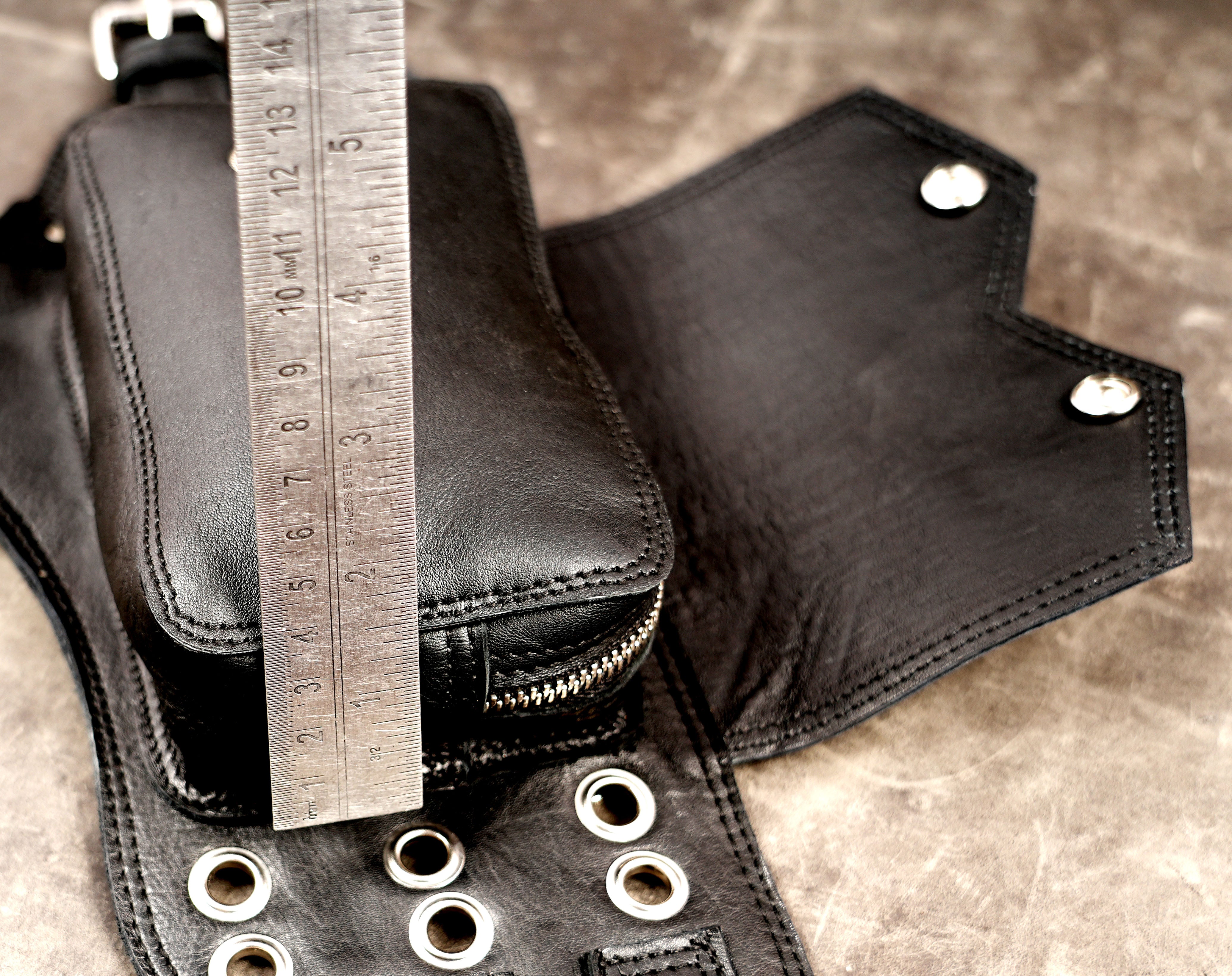 Leather biker belt with double pouches, top flat lay view