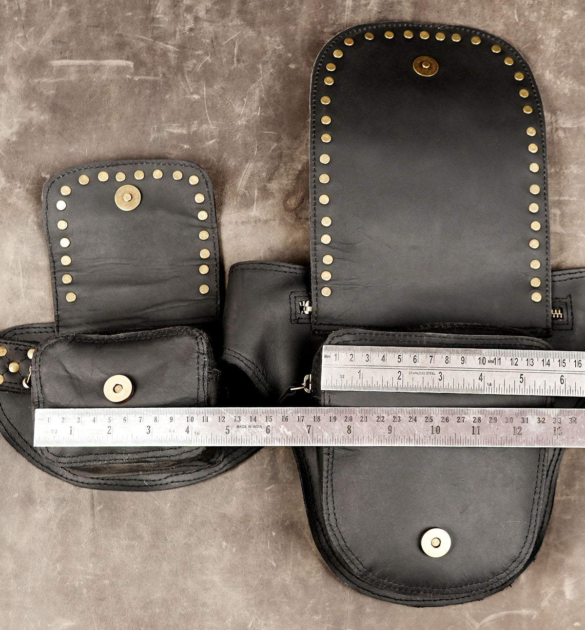 Leather crossbody belt with brass ring, full flat lay view