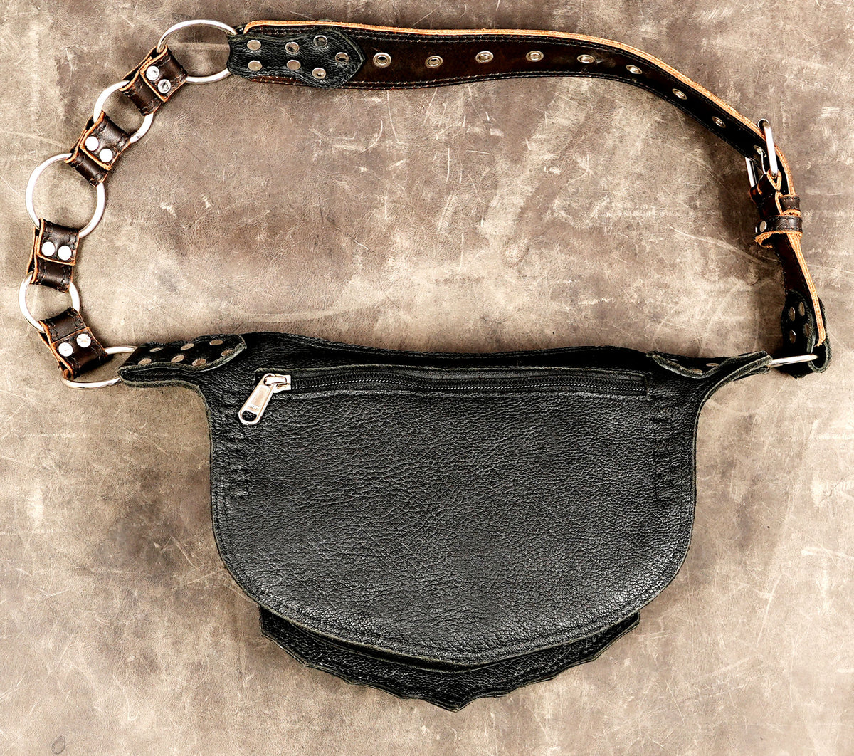 Leather festival accessory, gemstones displayed above bag