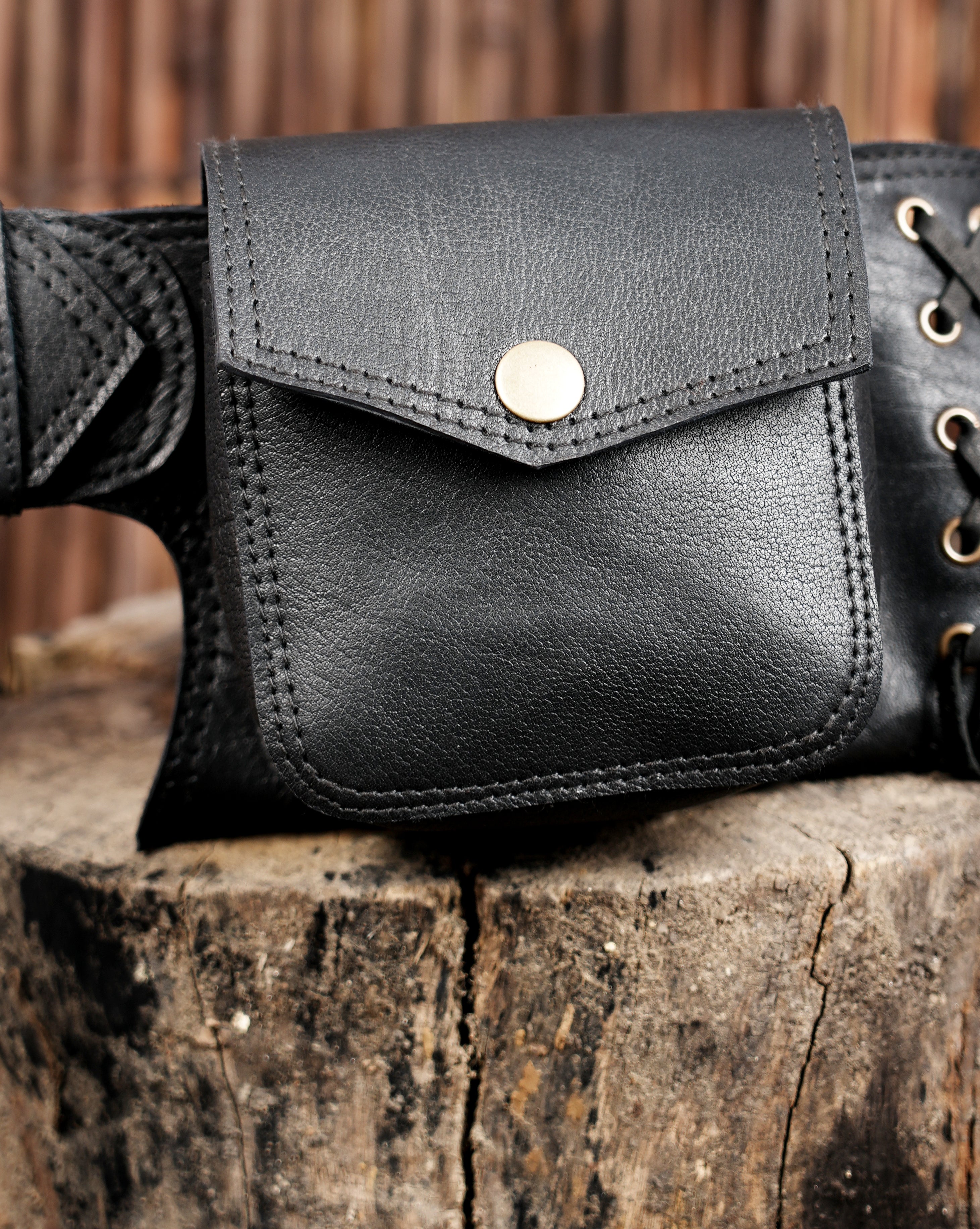 Leather festival belt with corset lace detail, flat lay view
