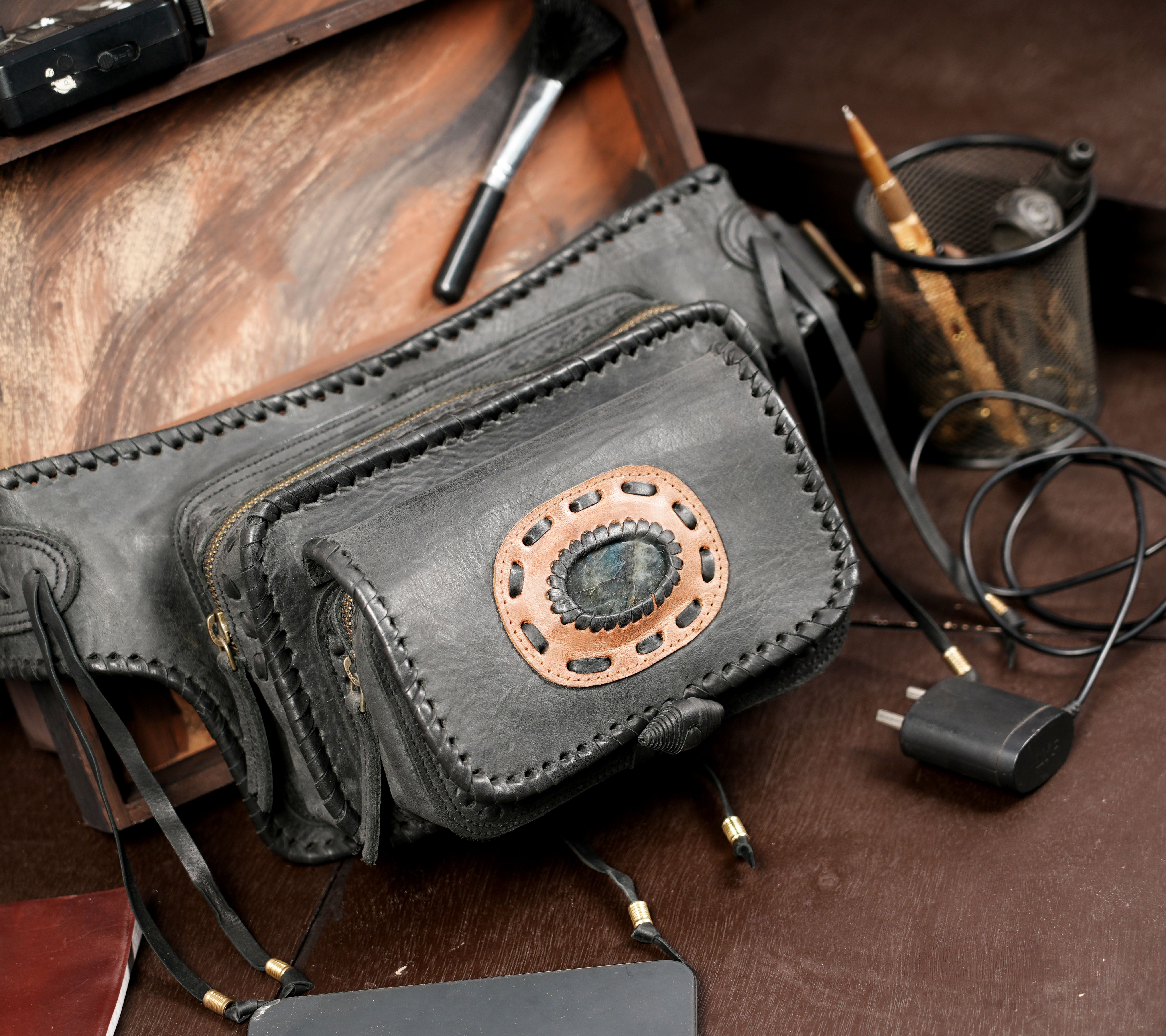 Leather festival pouch with fringe tassels and stone centerpiece