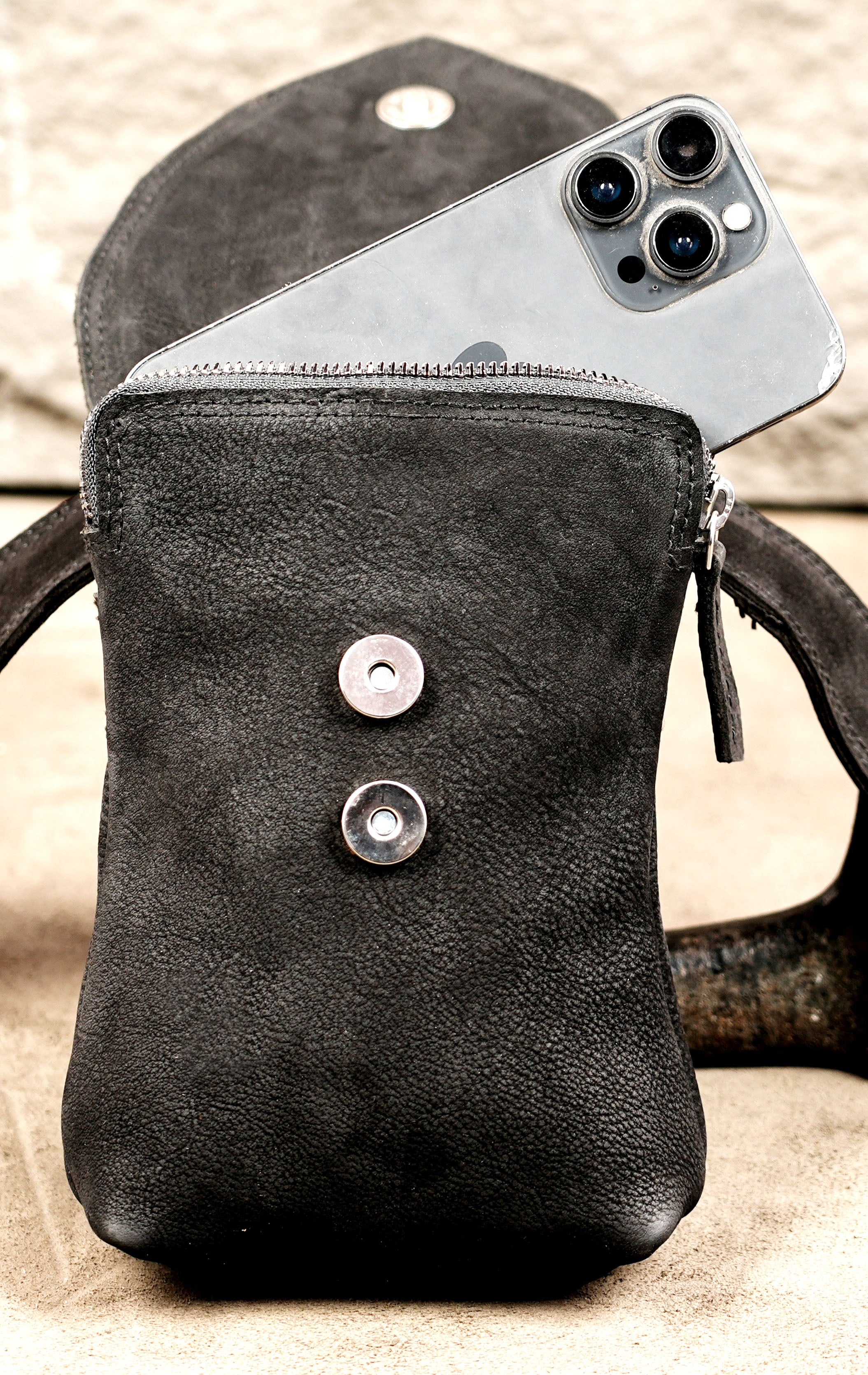 Leather hip accessory with pointed panel and studs