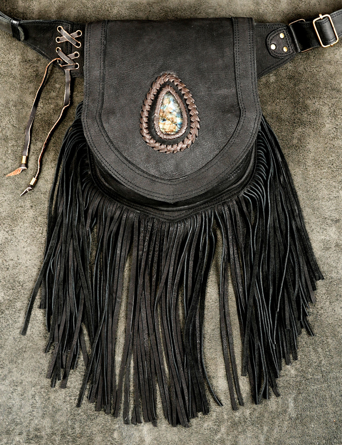 Leather hip bag with fringe and braided trim