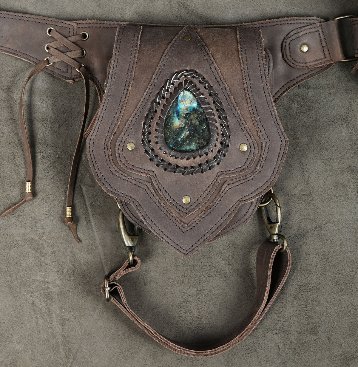 Leather holster pouch with scalloped tooling, flat lay view