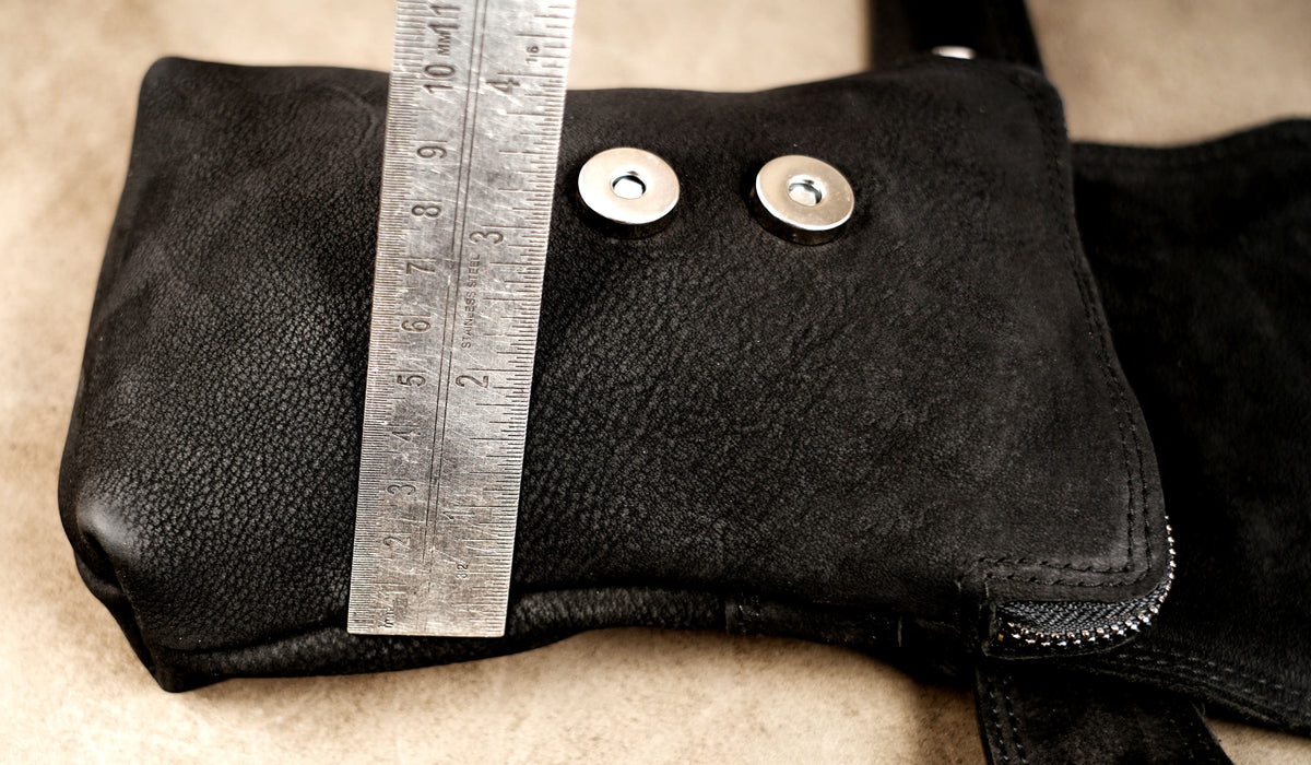 Leather pouch with triangular flap, urban minimal look