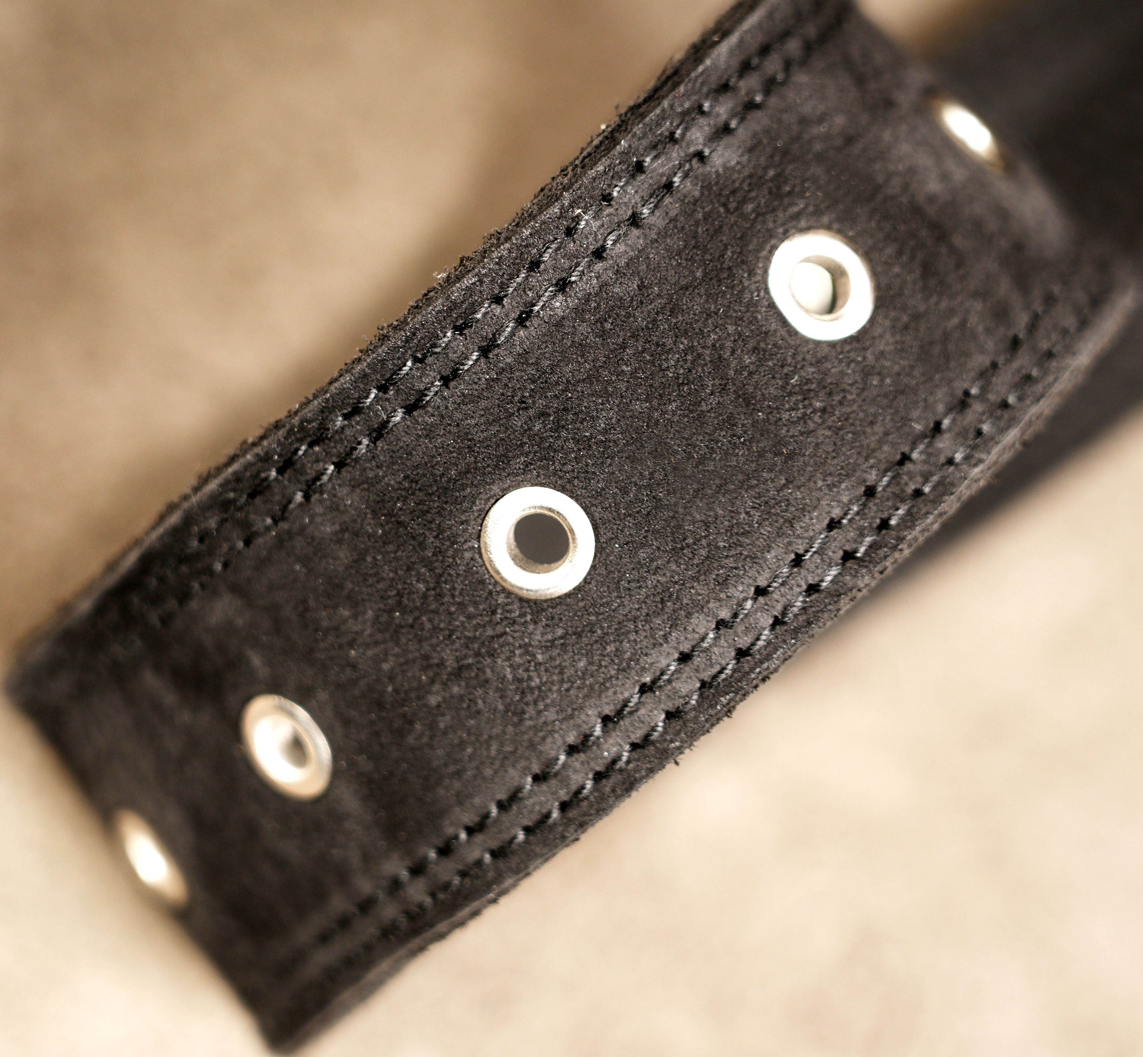 Leather utility pouch with V shaped flap and rivets
