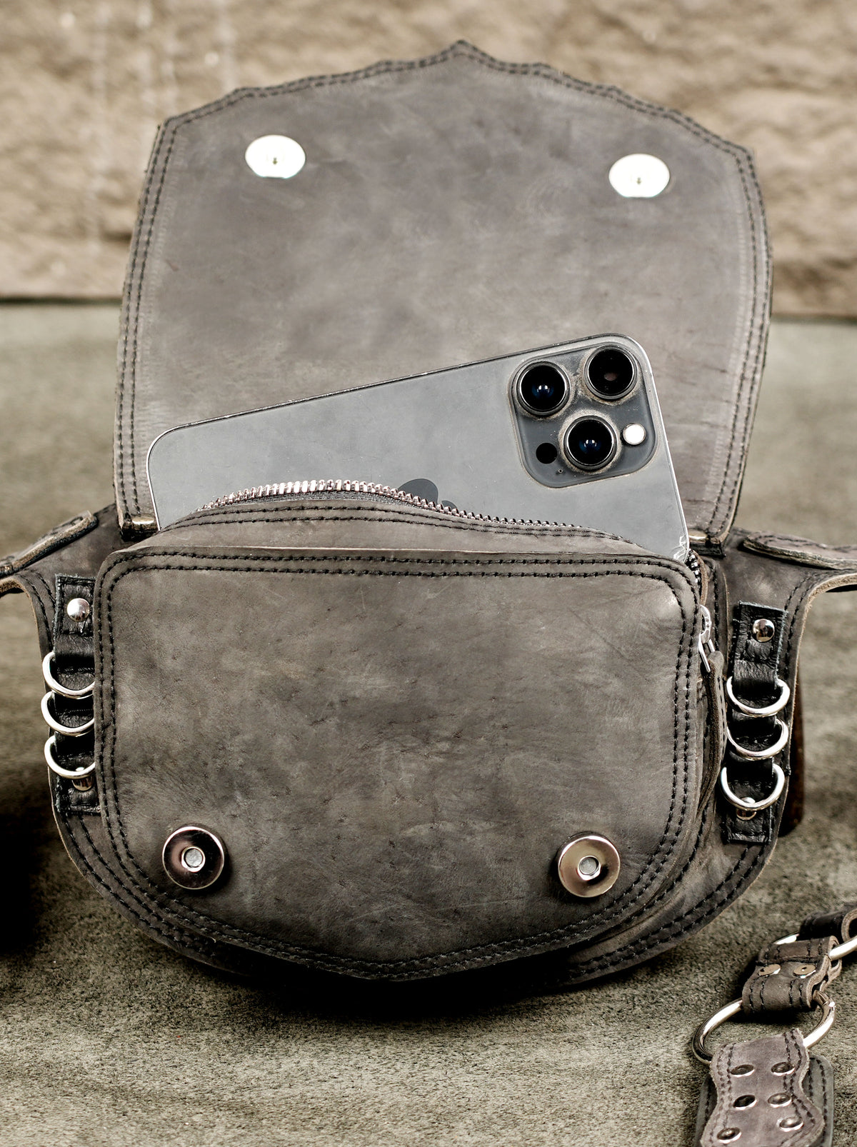 Leather waist accessory with chain and stud combination