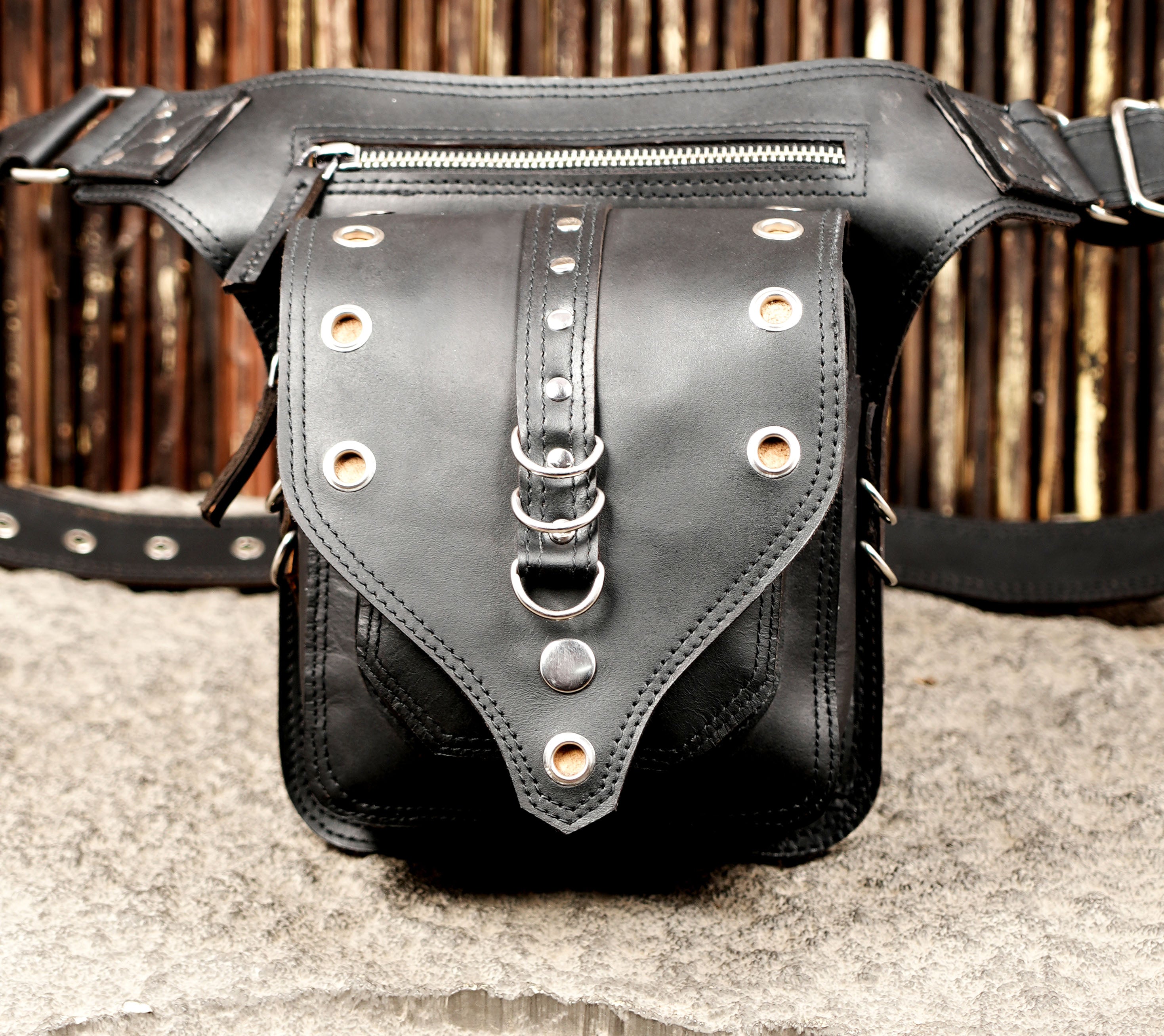 Leather waist bag with nickel silver hardware, flat lay view