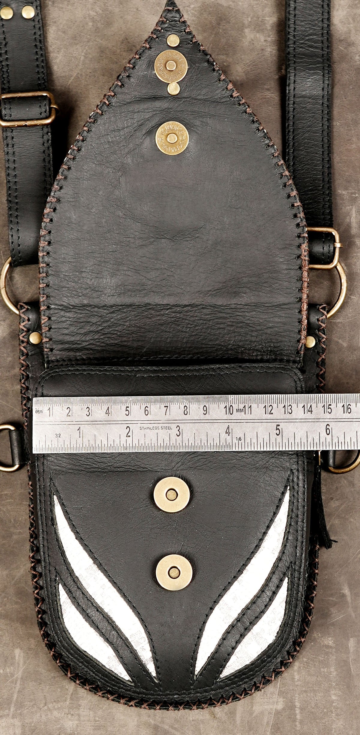 Bold black and white utility rig featuring dual front pouches