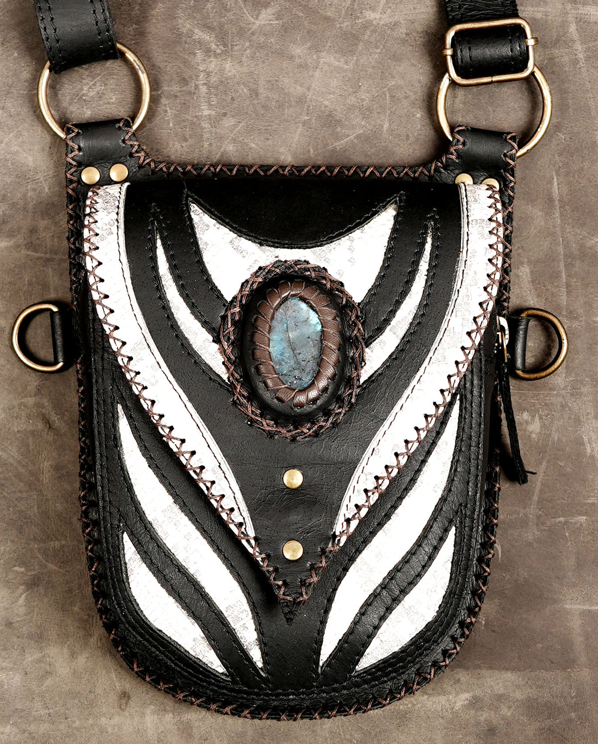 Alternative fashion holster bag with shoulder straps and brass hardware