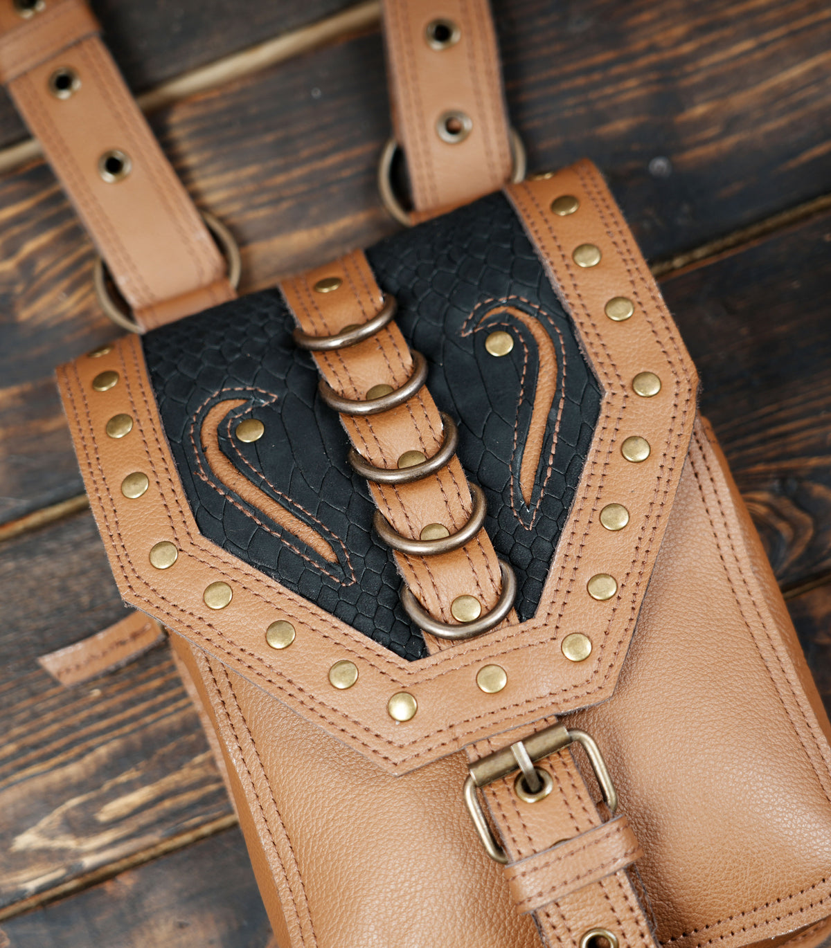 Handmade leather festival bag set with decorative stitching and rivets