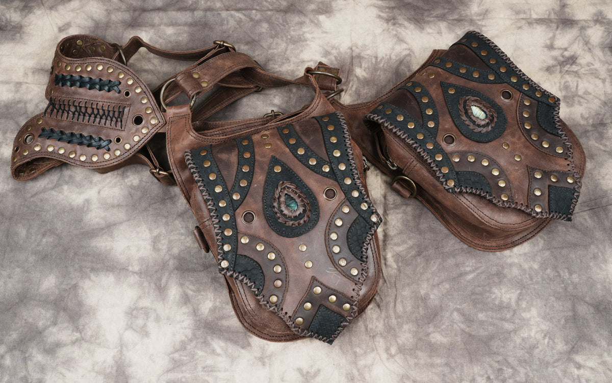 Festival wear accessory in brown leather with dual storage compartments and detailed handcrafted trim.